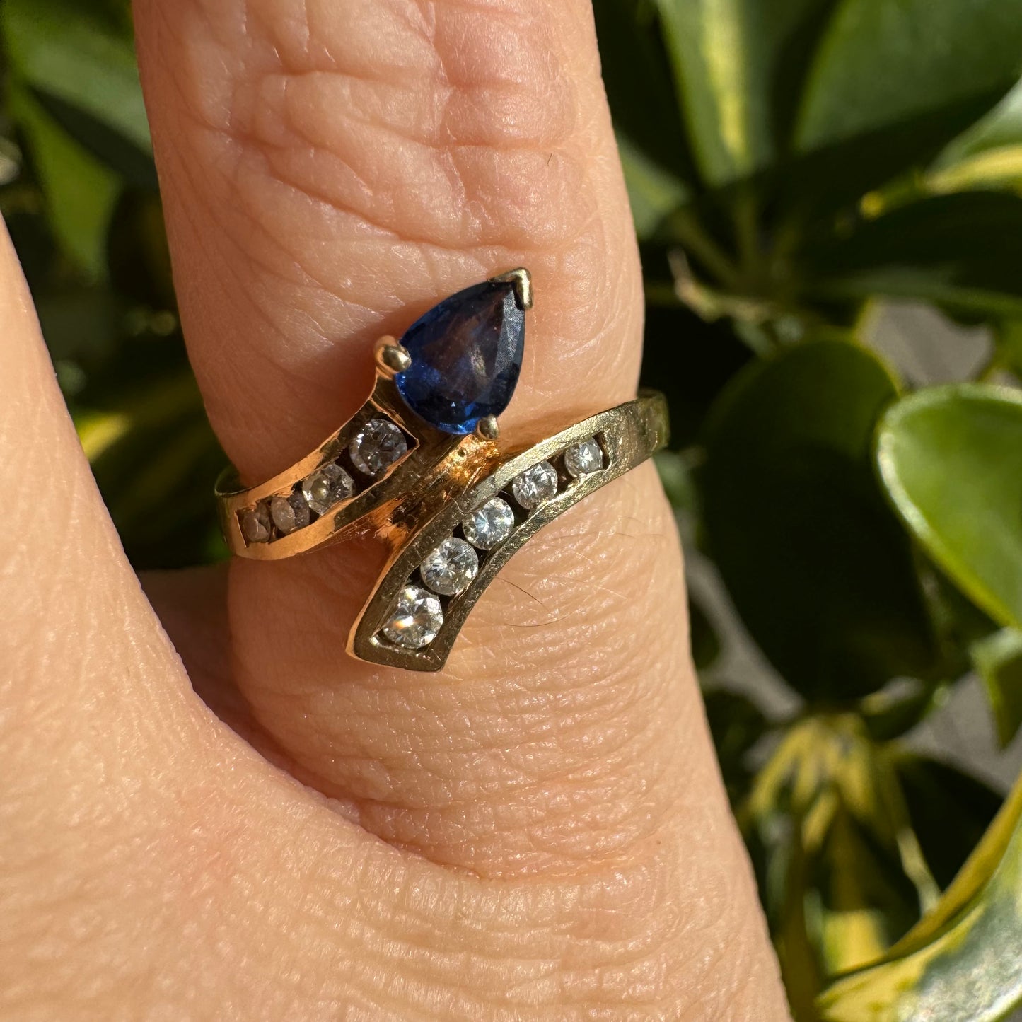 14K gold ring set with a teardrop-shaped Sapphire & Diamonds