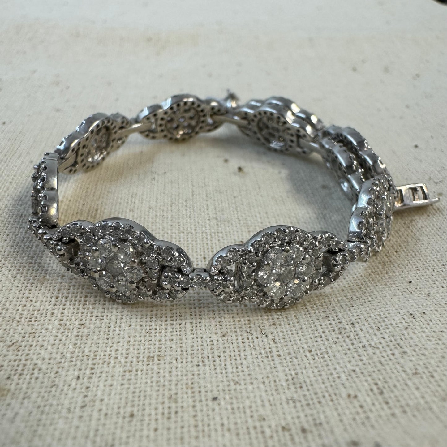 14K gold Tennis bracelet set rows of sparkling Diamonds in a dazzling halo design