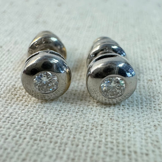 18K gold earrings set with one center Diamond