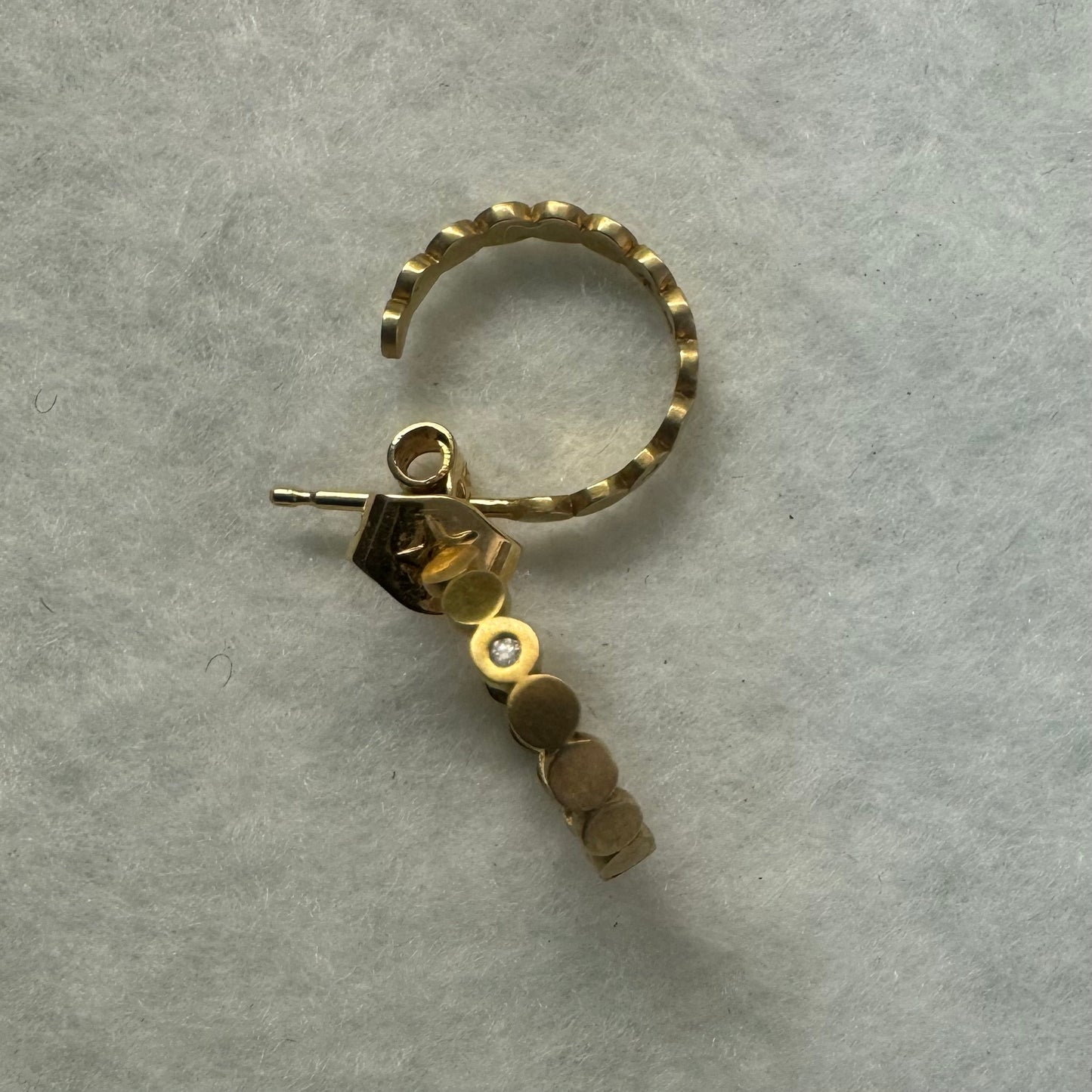 18K gold “H.Stern” hoop earrings set with one Diamond