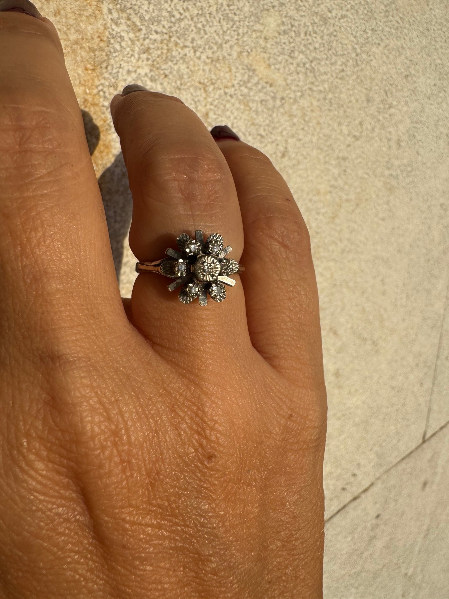 18K gold floral ring adorned with delicate diamond accents