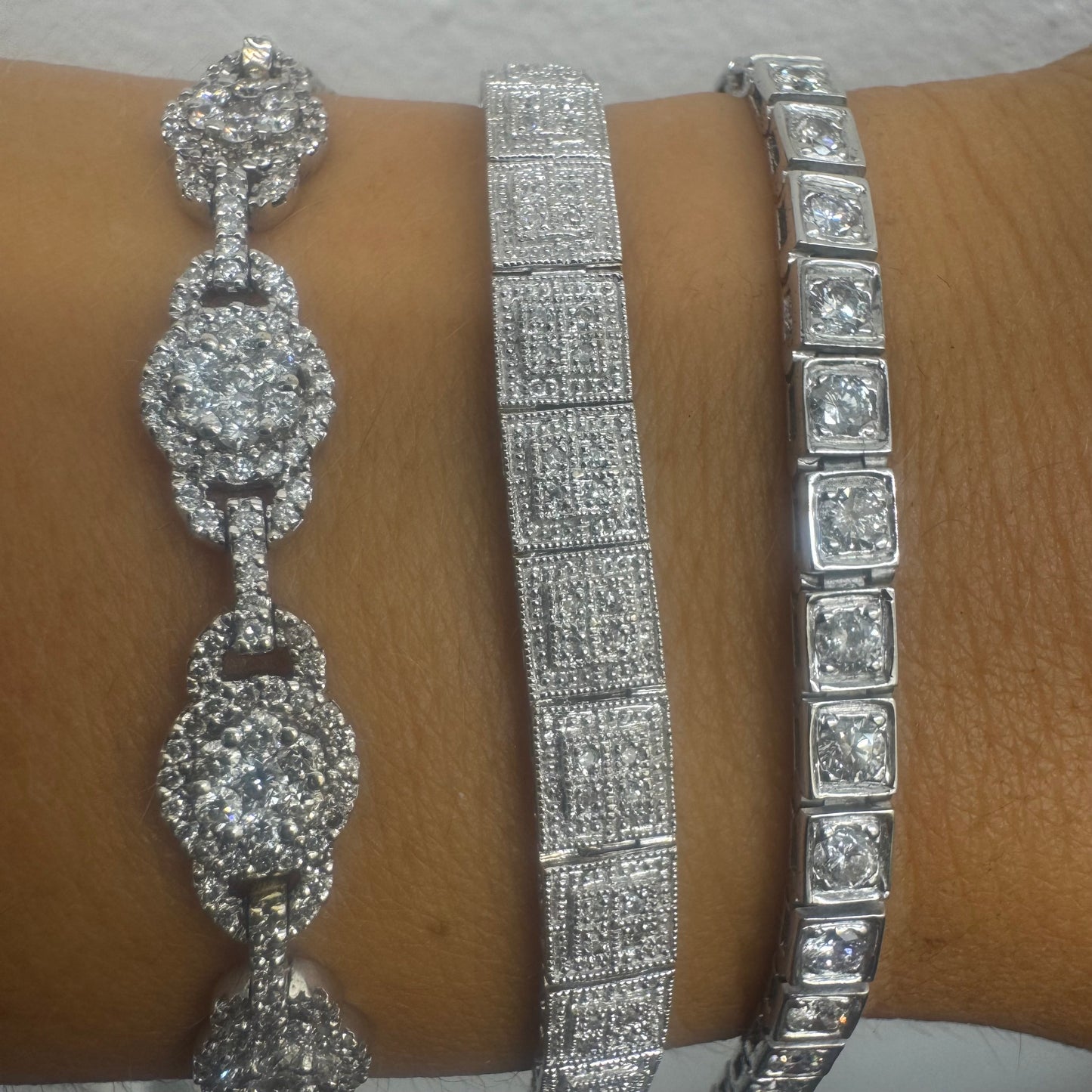 18K gold tennis bracelet set with sparkling round-cut Diamonds in square bezel settings, creating a timeless and sophisticated look.