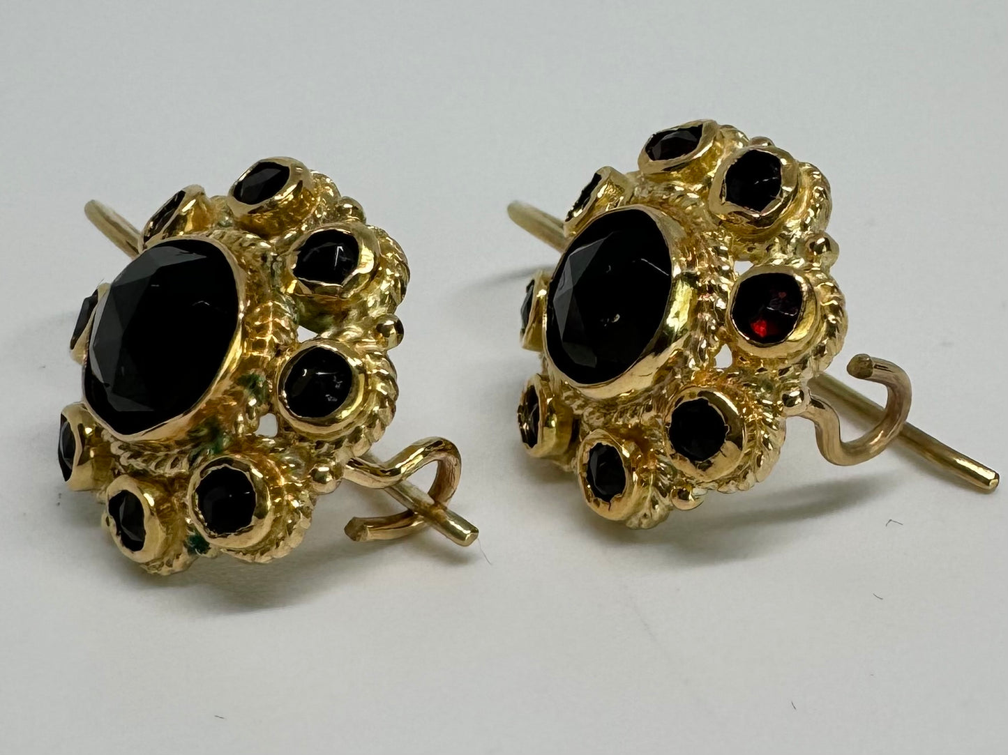 14K gold drop earrings set with deep red Garnets arranged in a bold circular design