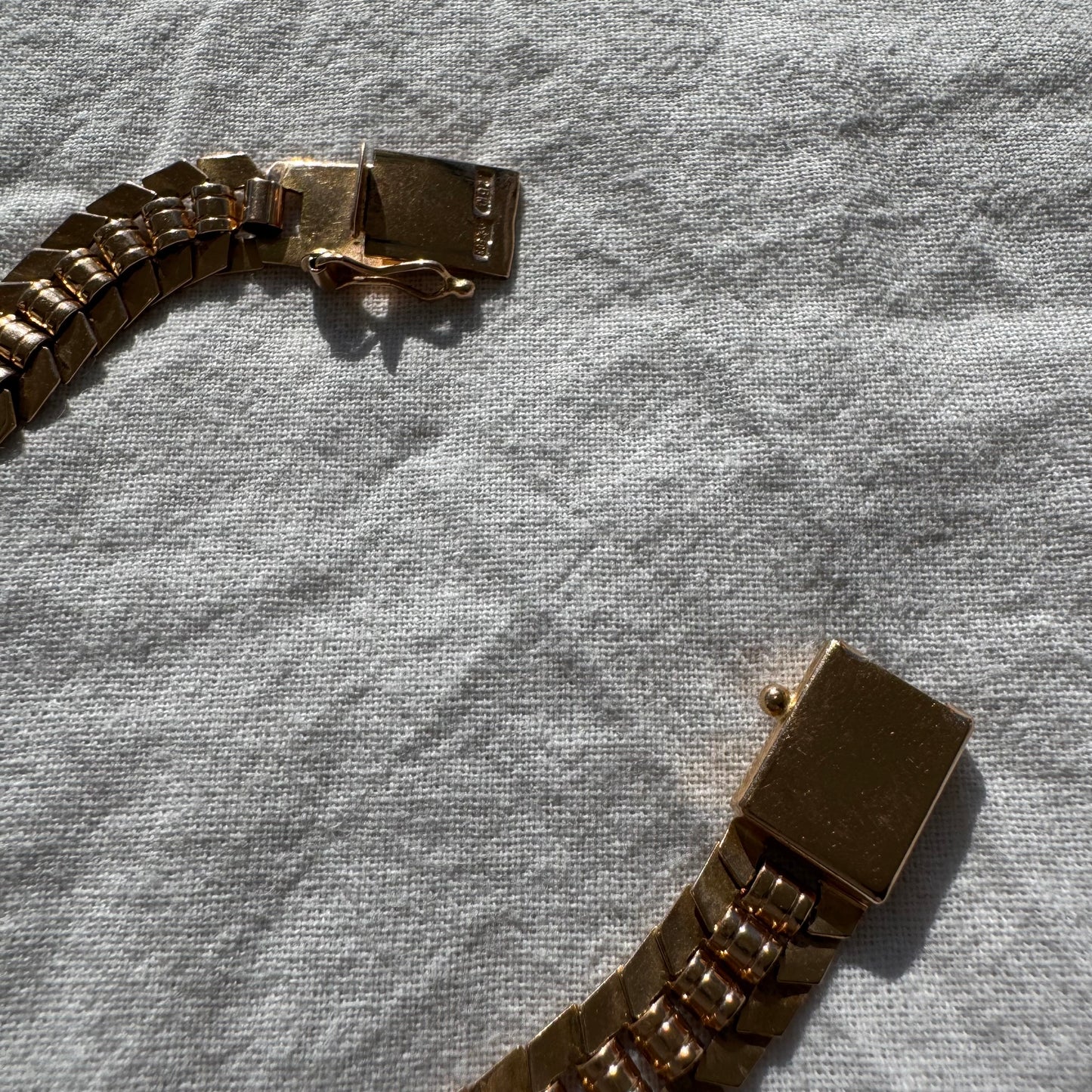 14K gold bracelet with a bold, flexible link design and a secure box clasp.