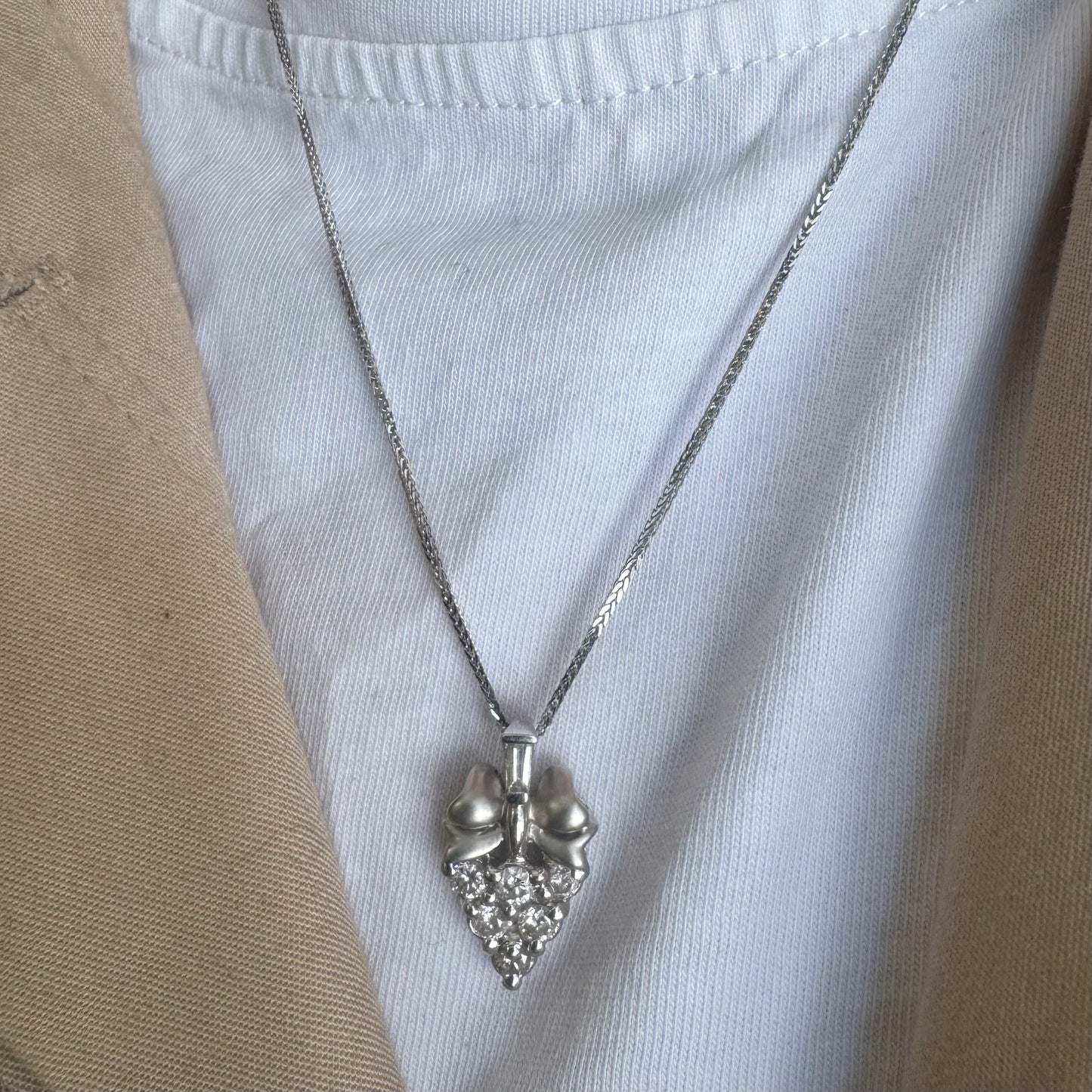 18K gold pendant, crafted in a timeless grape cluster design and set with sparkling diamonds.