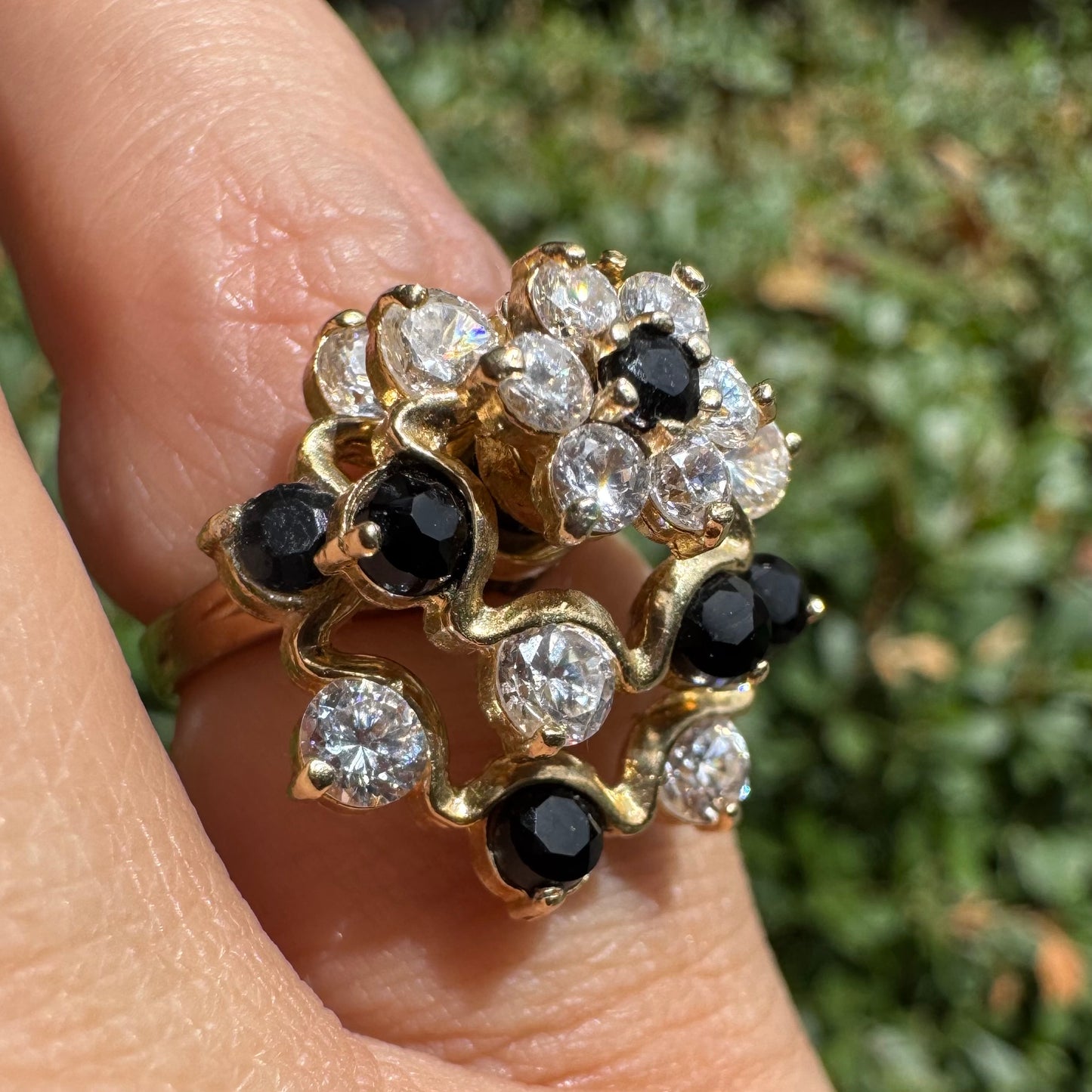 14K gold kinetic cocktail ring set with black and transparent stones