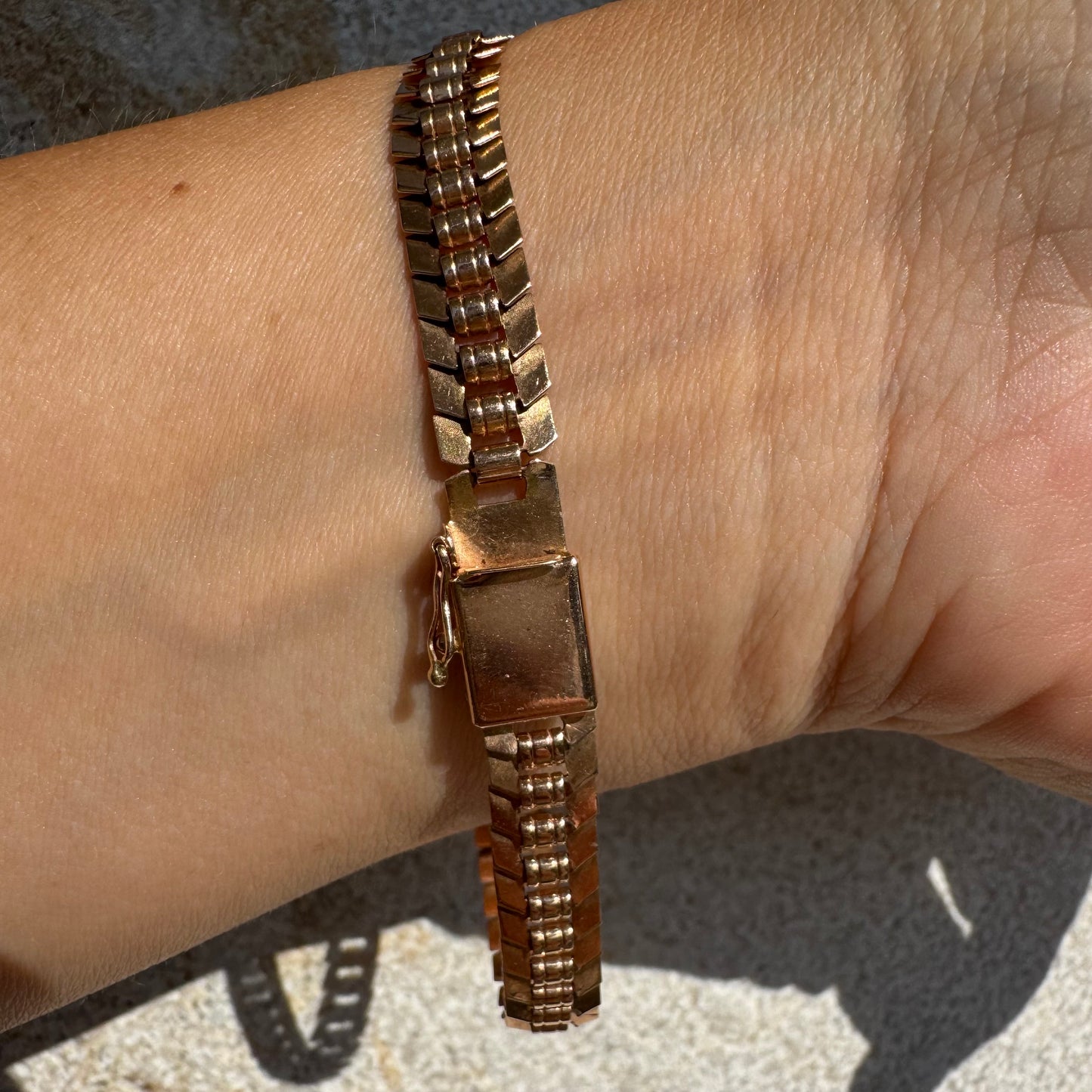14K gold bracelet with a bold, flexible link design and a secure box clasp.