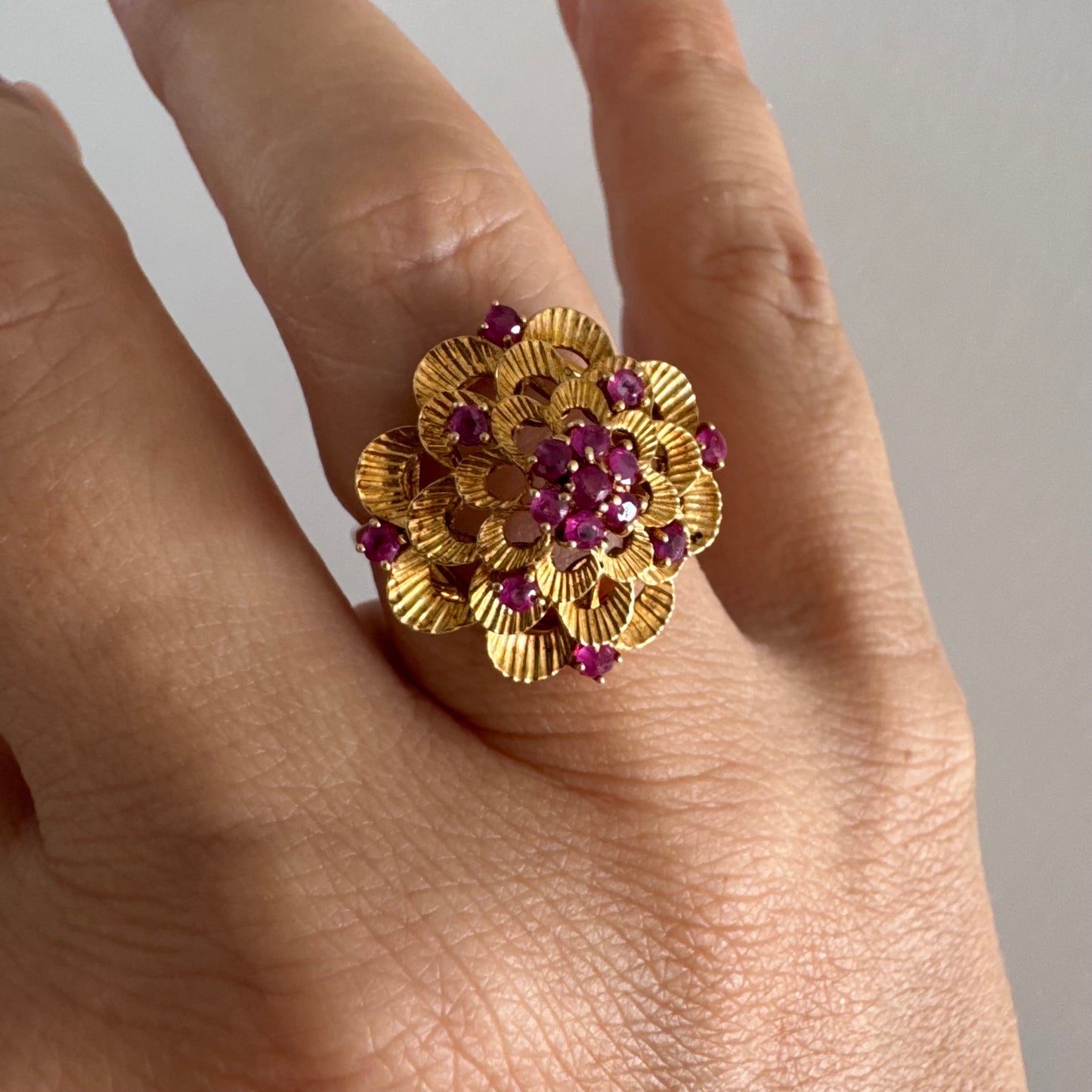 18K gold ring crafted in yellow gold, designed in a layered floral motif set with Rubies