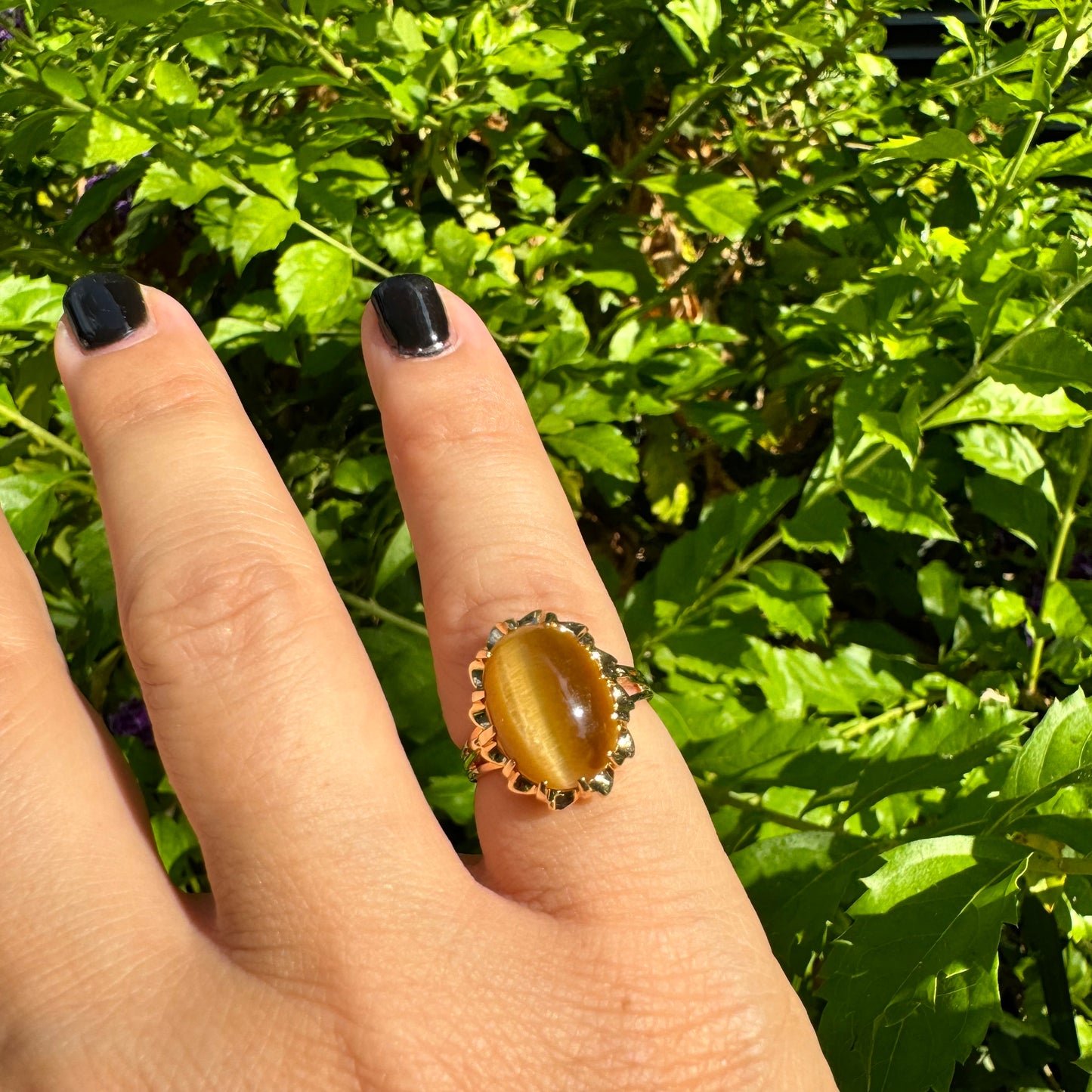 14K gold ring set with a yellow Cat’s Eye cabochon