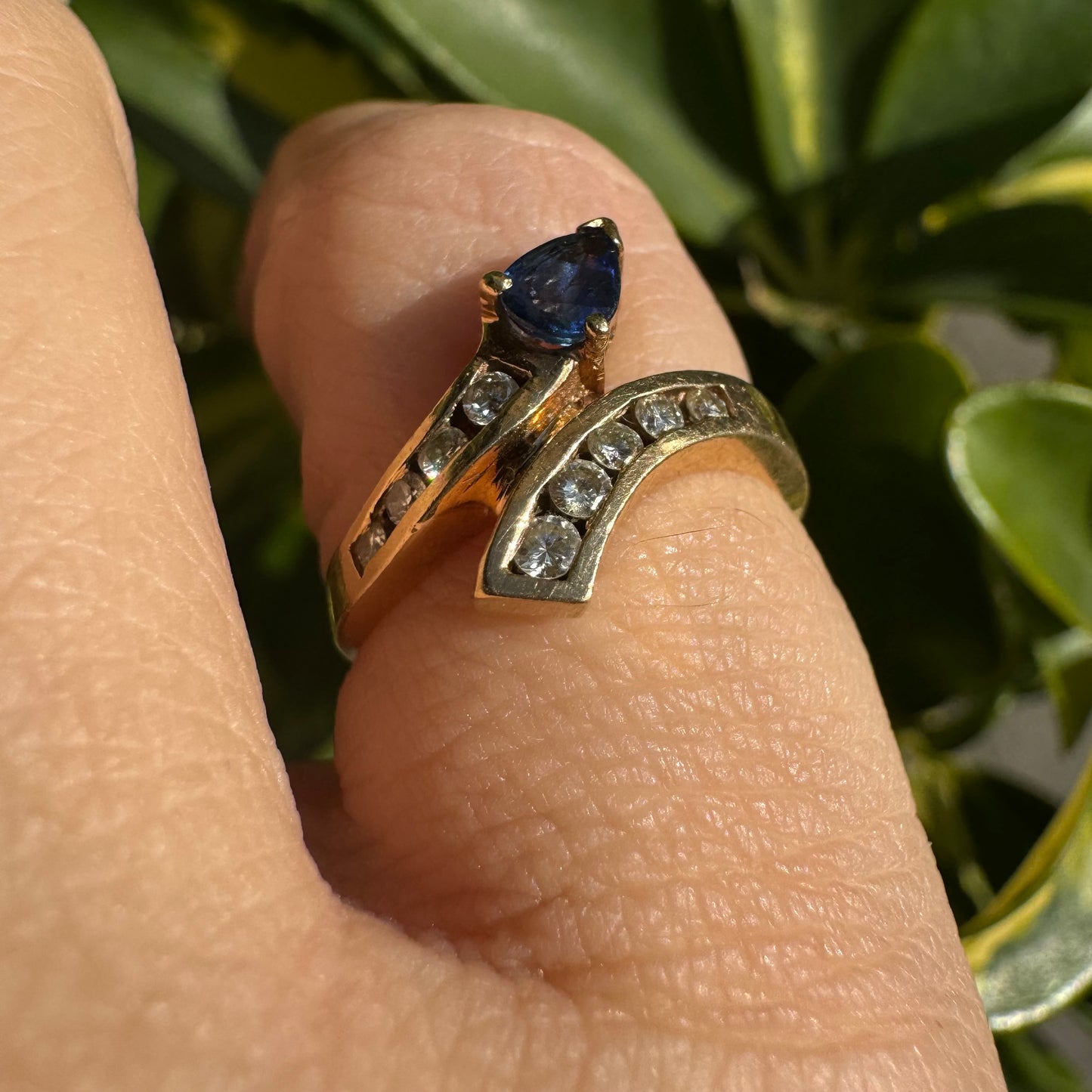 14K gold ring set with a teardrop-shaped Sapphire & Diamonds