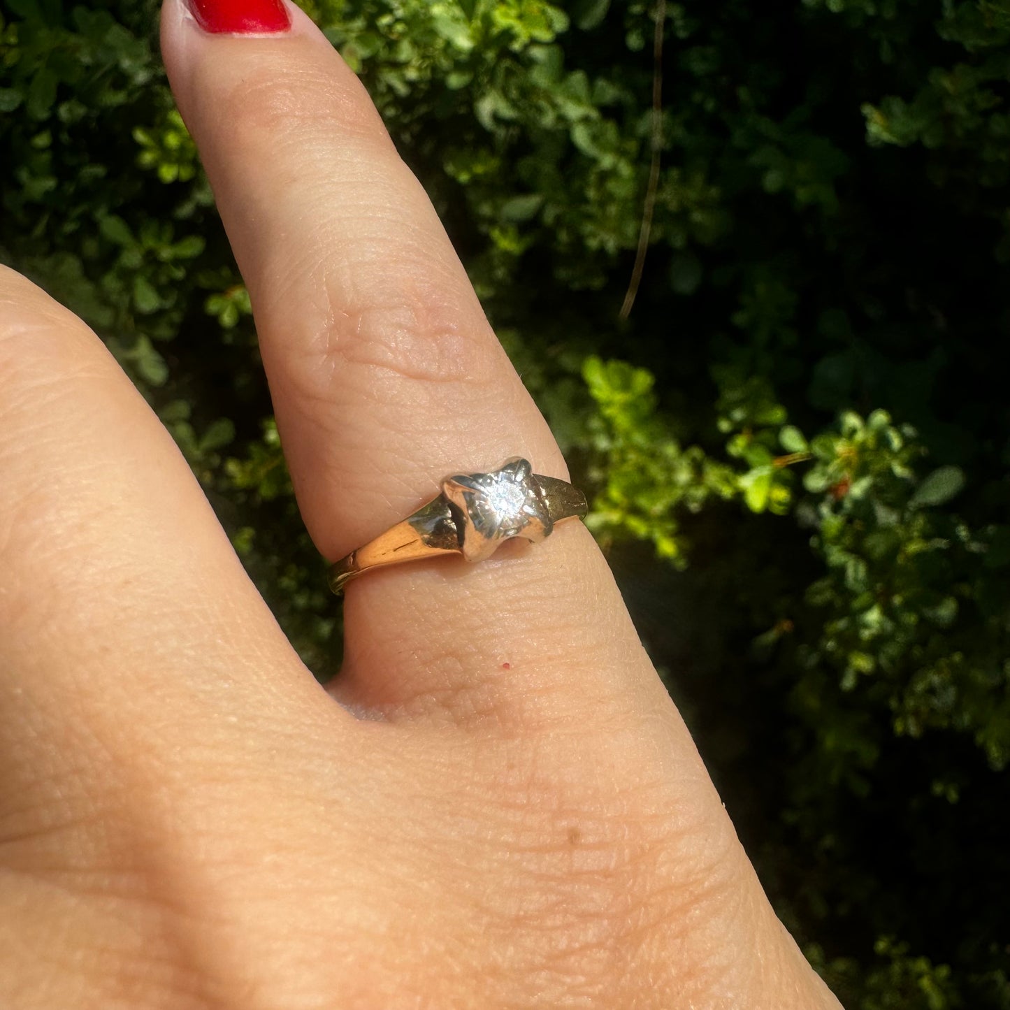 14K gold ring set with one center Diamond