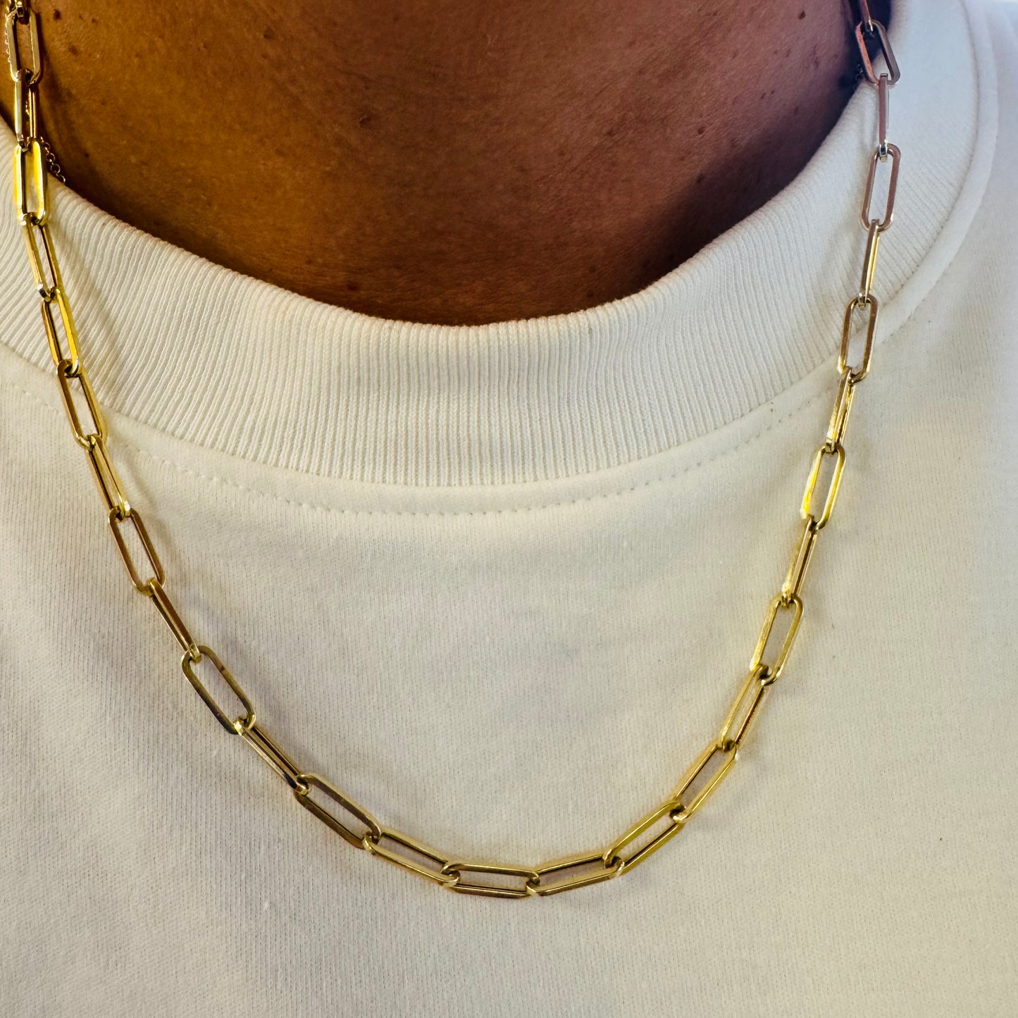 14K gold link chain, designed with elongated open links that create a bold yet refined silhouette.