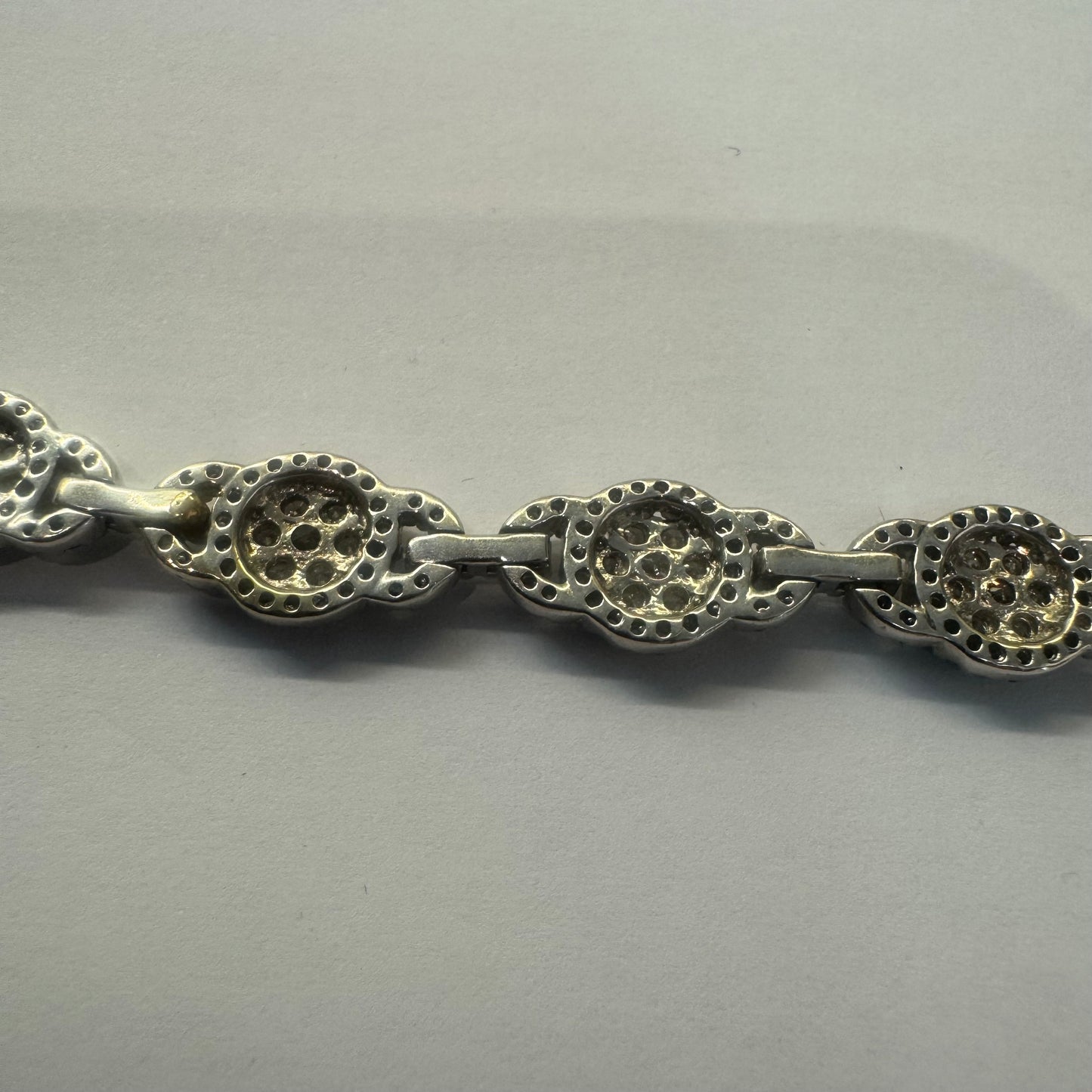 14K gold Tennis bracelet set rows of sparkling Diamonds in a dazzling halo design