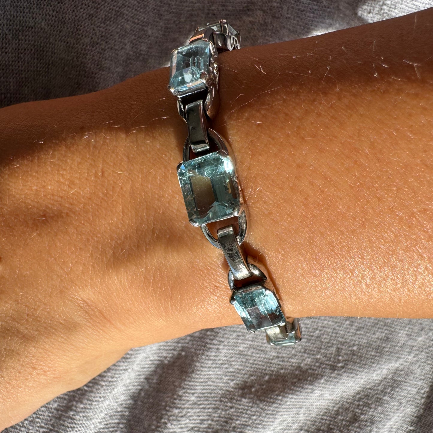18K white gold bracelet set with large emerald-cut Aquamarine stones — elegant, radiant, and timeless.