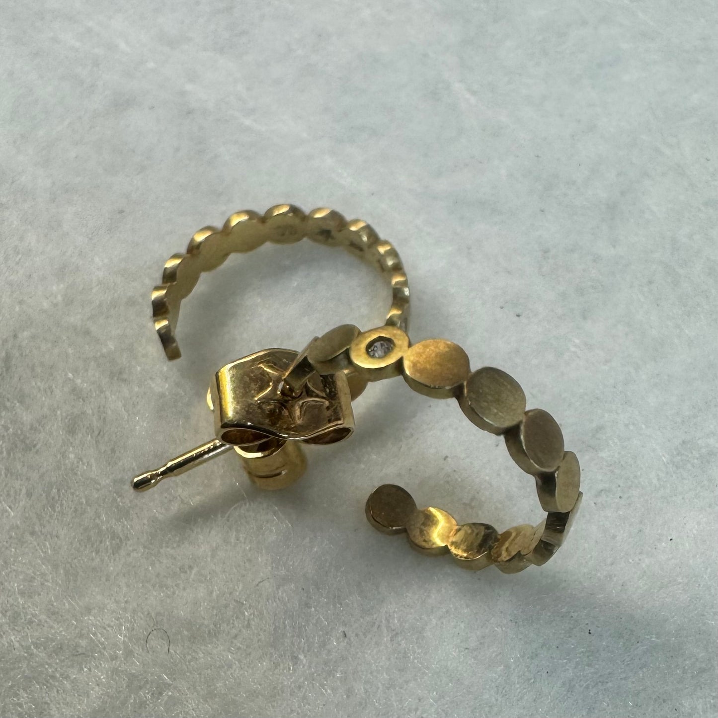 18K gold “H.Stern” hoop earrings set with one Diamond