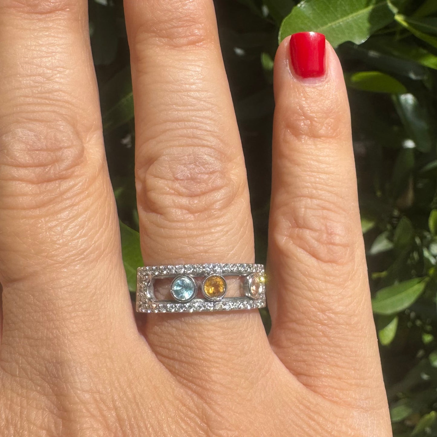 14K gold ring set with Blue Topaz, Citrine, and Rose Quartz, framed by a pave’ of sparkling diamonds