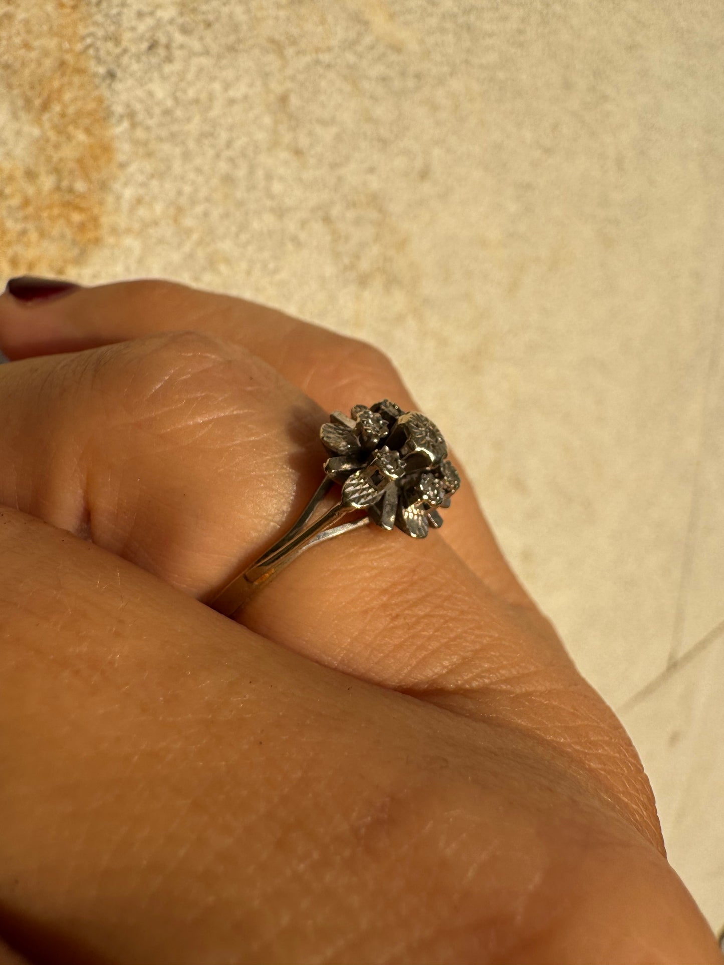 18K gold floral ring adorned with delicate diamond accents