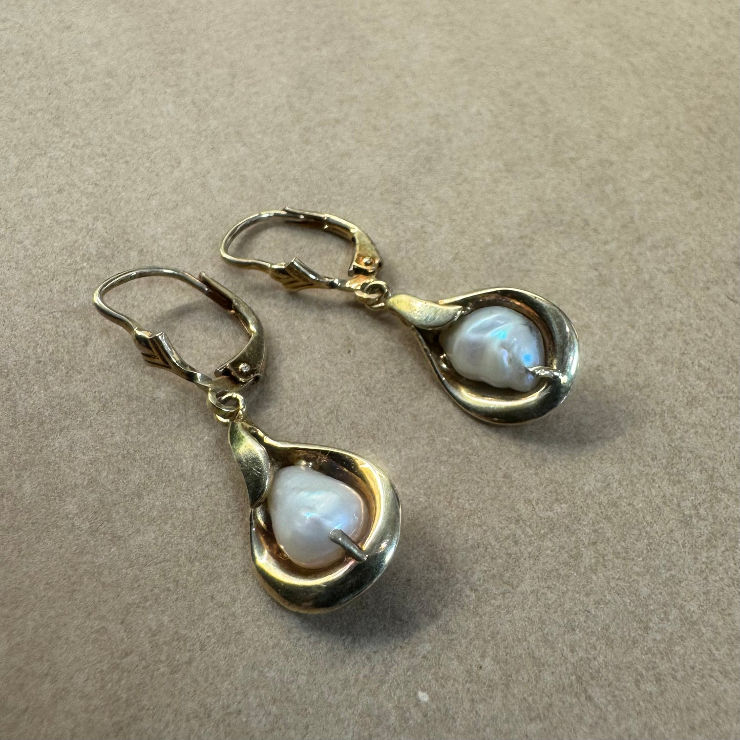 14K gold drop earrings featuring baroque Pearls set in fluid, organic shape