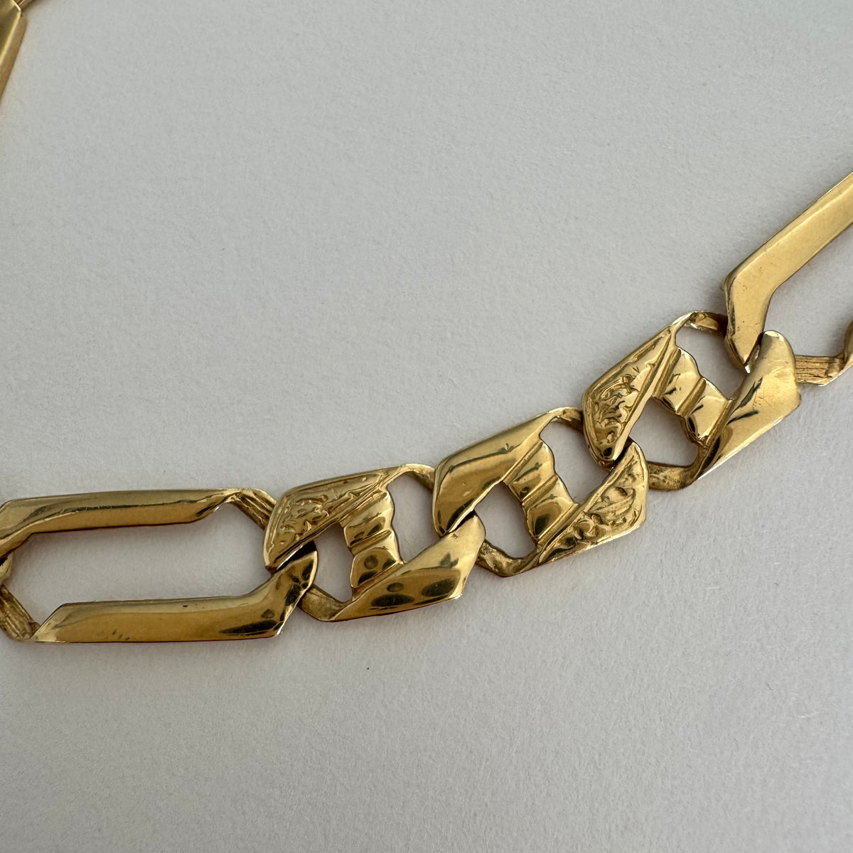 14K gold bracelet with a modern, distinctive link design