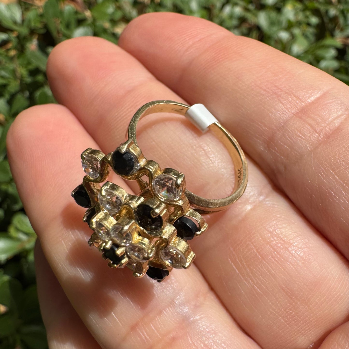 14K gold kinetic cocktail ring set with black and transparent stones