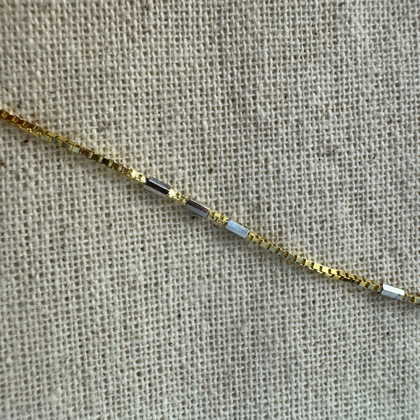 14K gold necklace with a cheerful floral pendant crafted from four pear-shaped Blue Topaz gemstones, arranged in a radiant blossom design