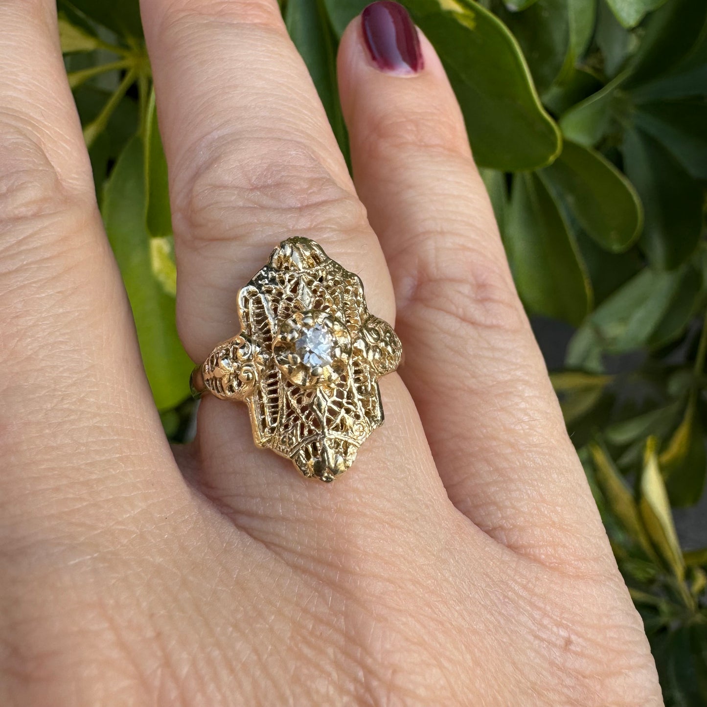 14K gold filigree ring set with an old-cut Diamond