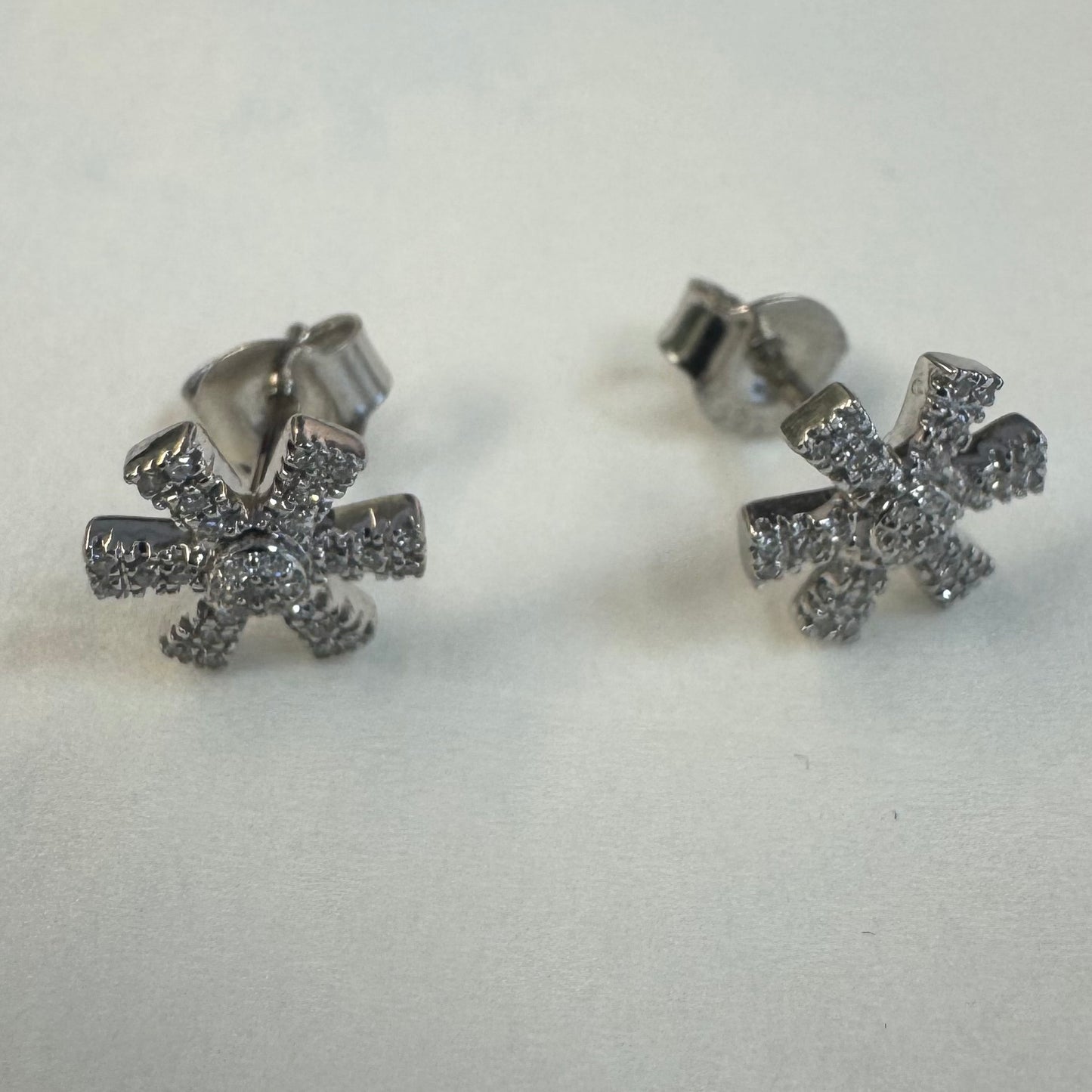 14K gold stud earrings set with Diamonds