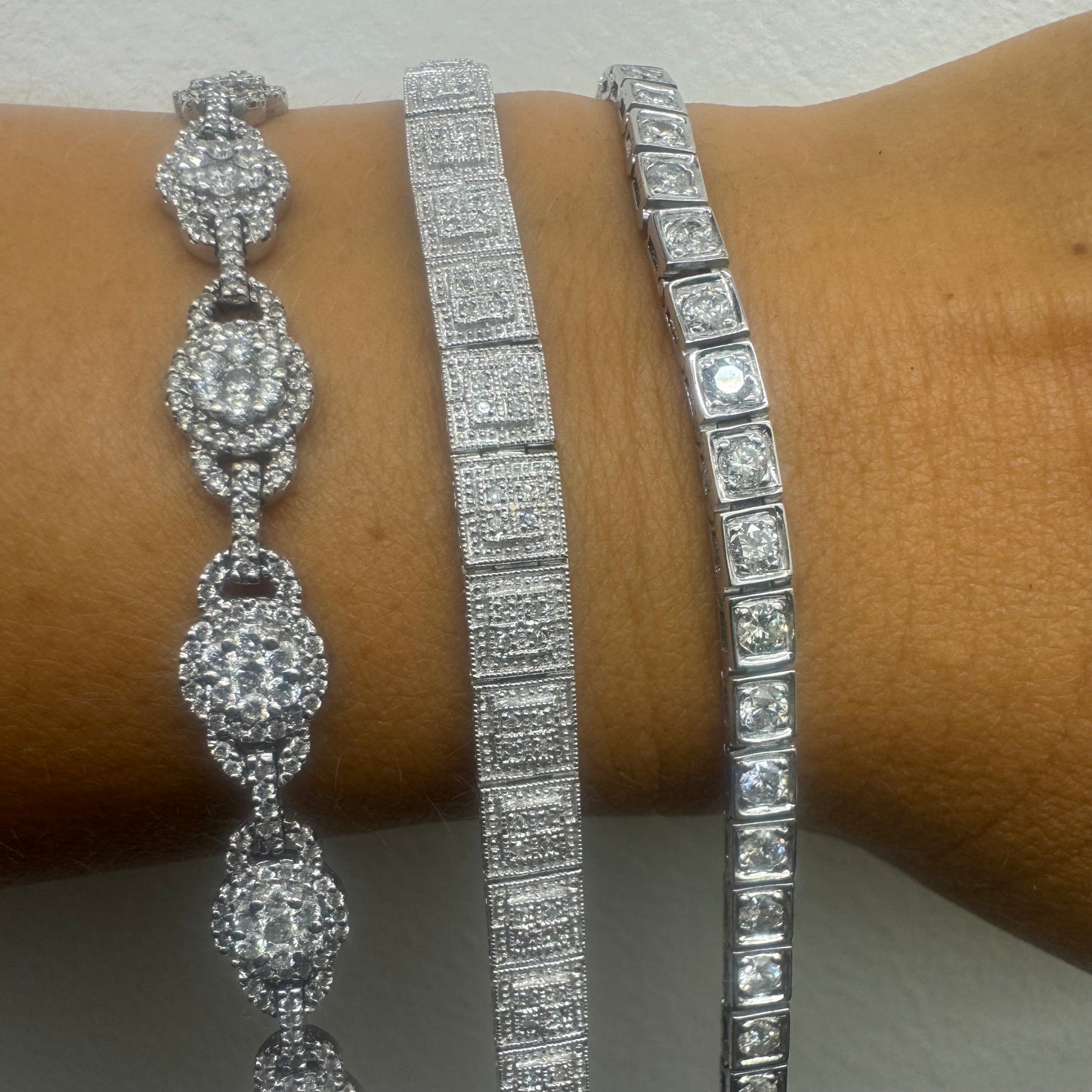 18K gold tennis bracelet set with sparkling round-cut Diamonds in square bezel settings, creating a timeless and sophisticated look.