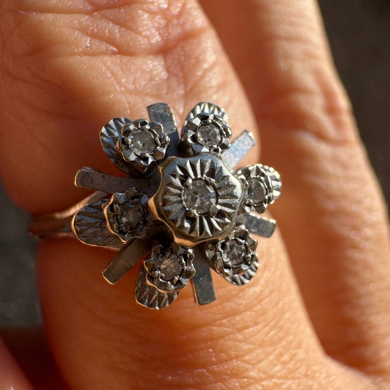 18K gold floral ring adorned with delicate diamond accents