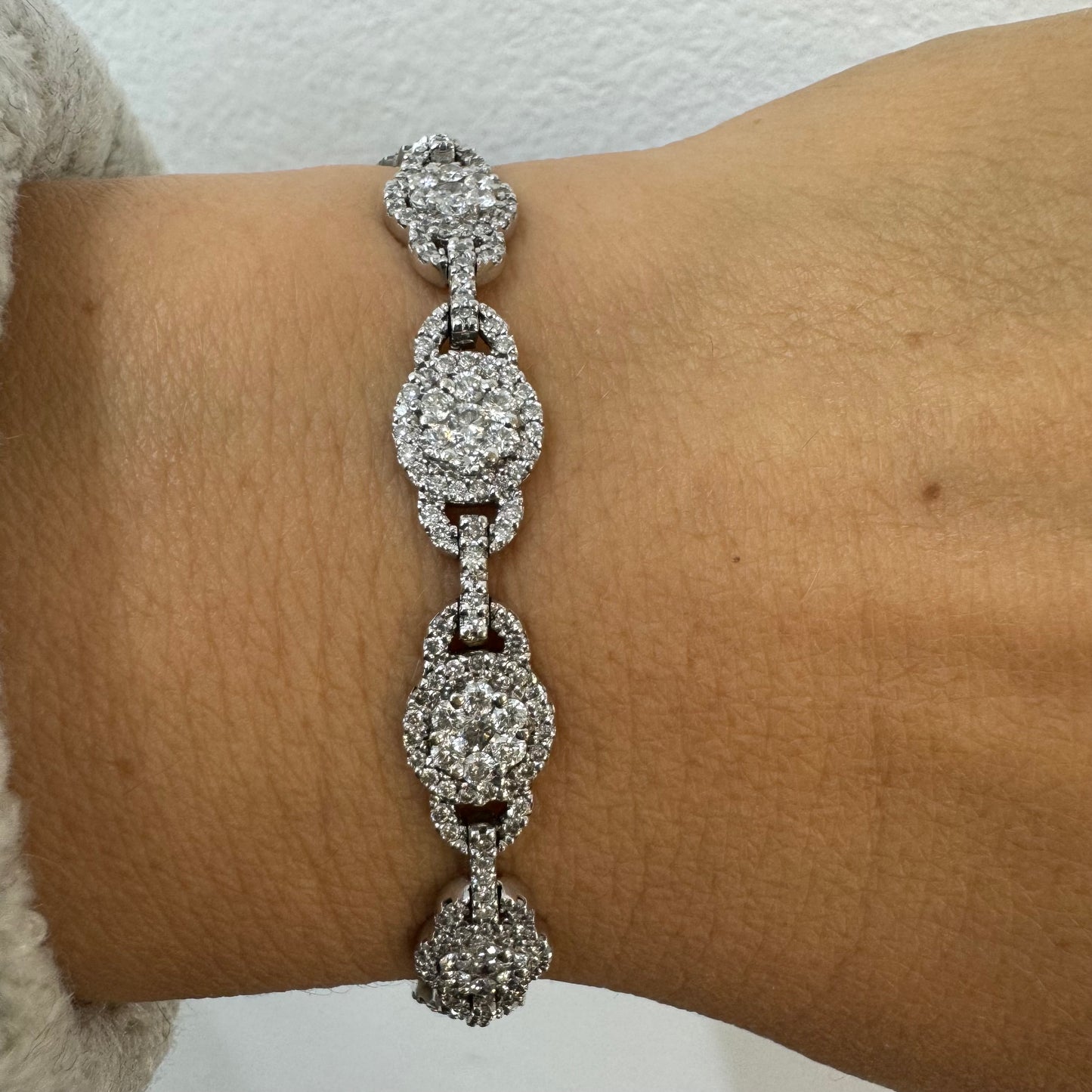 14K gold Tennis bracelet set rows of sparkling Diamonds in a dazzling halo design