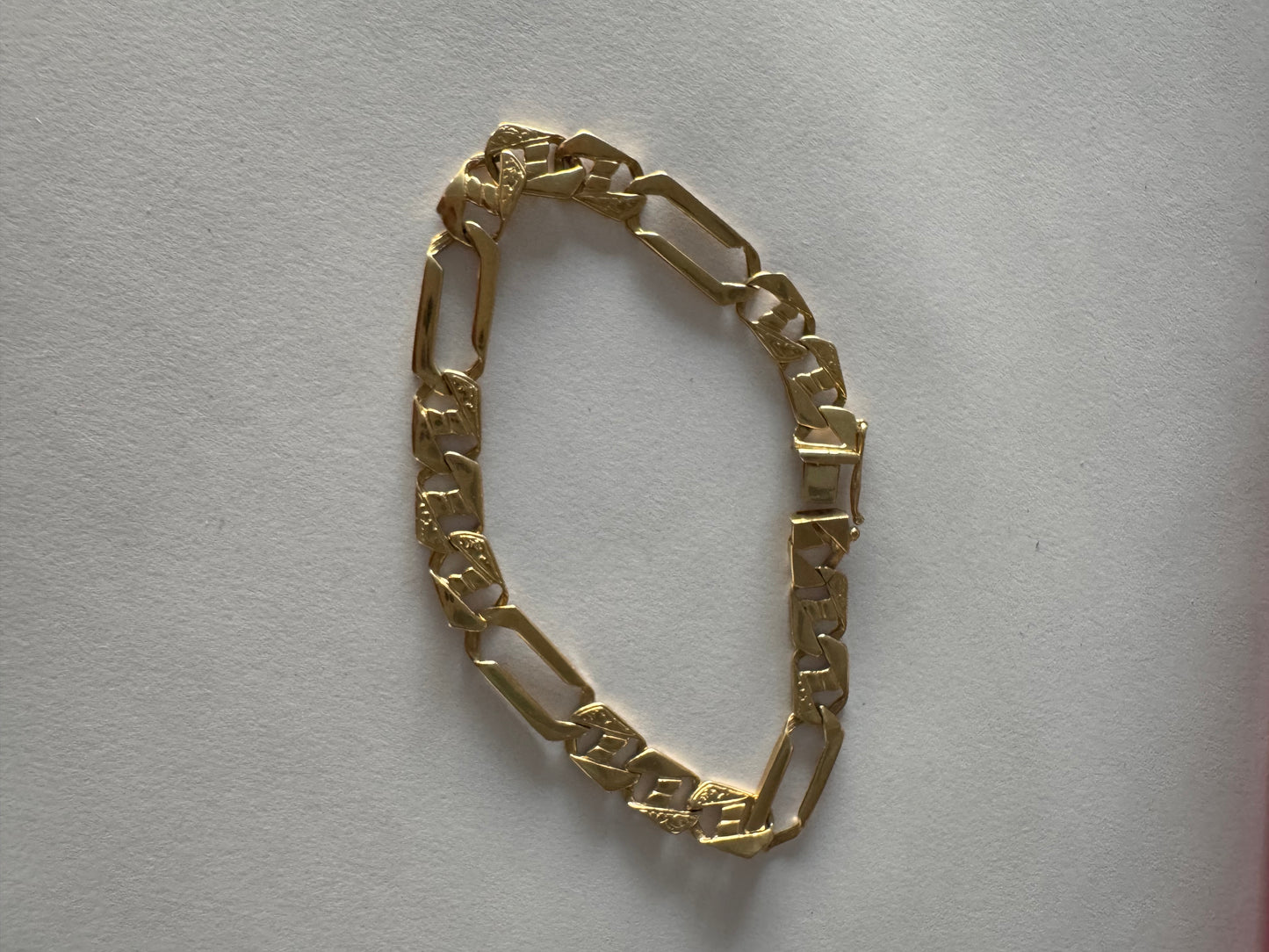 14K gold bracelet with a modern, distinctive link design