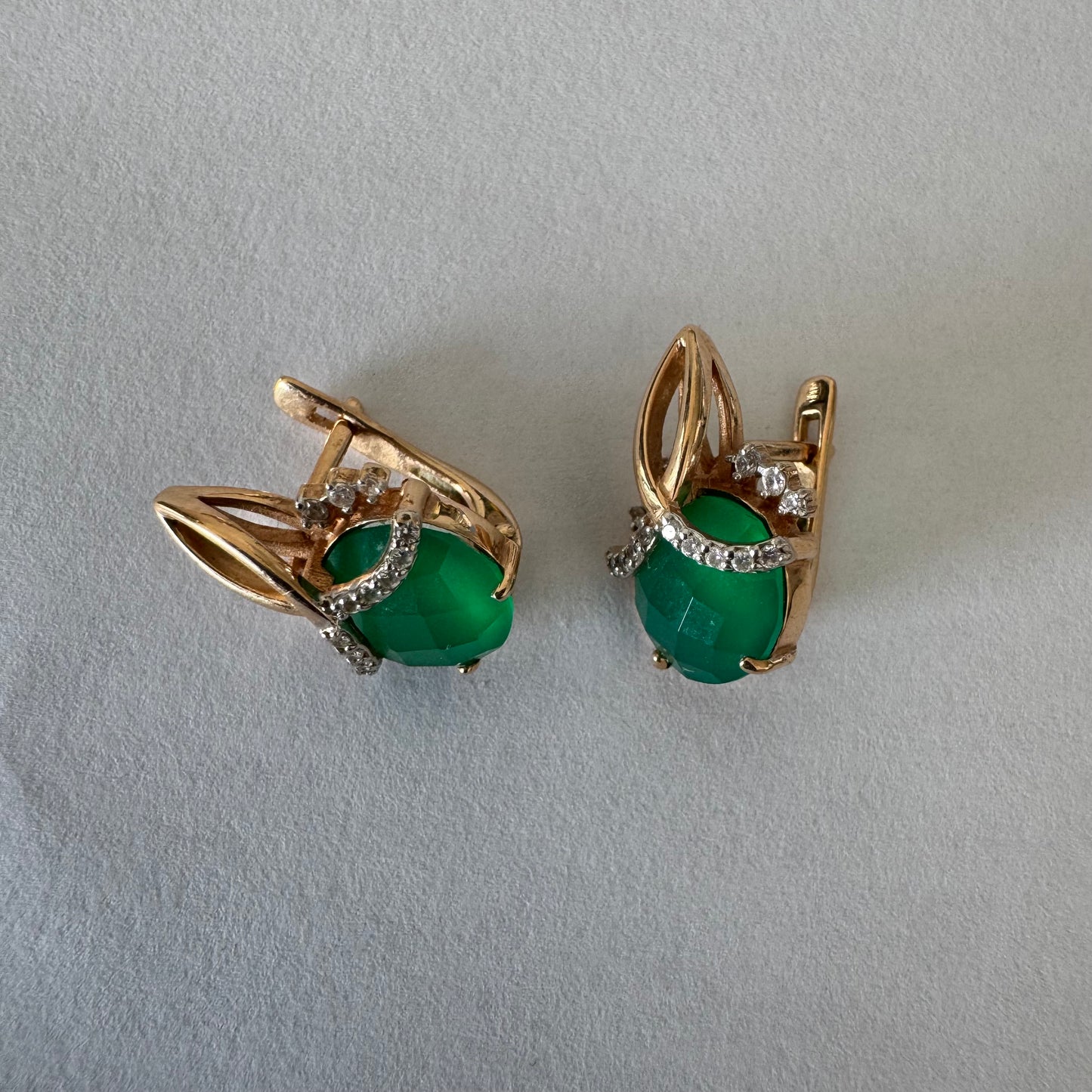 14K gold earrings set with vibrant green stones
