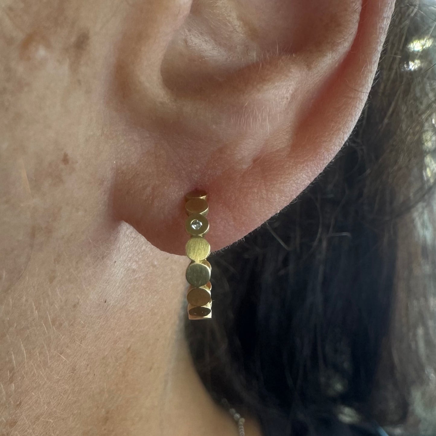 18K gold “H.Stern” hoop earrings set with one Diamond