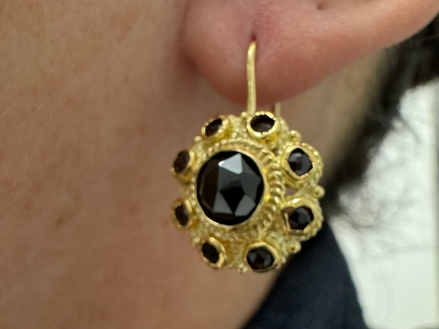 14K gold drop earrings set with deep red Garnets arranged in a bold circular design