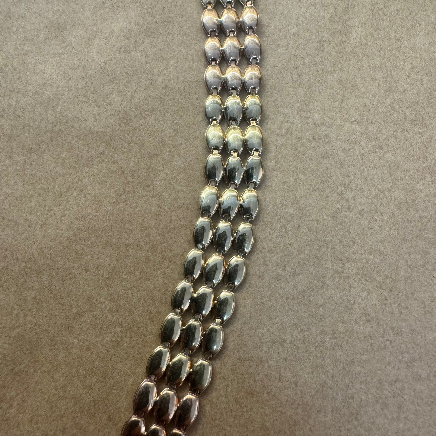 14K tri-color gold bracelet featuring yellow, white and rose gold links