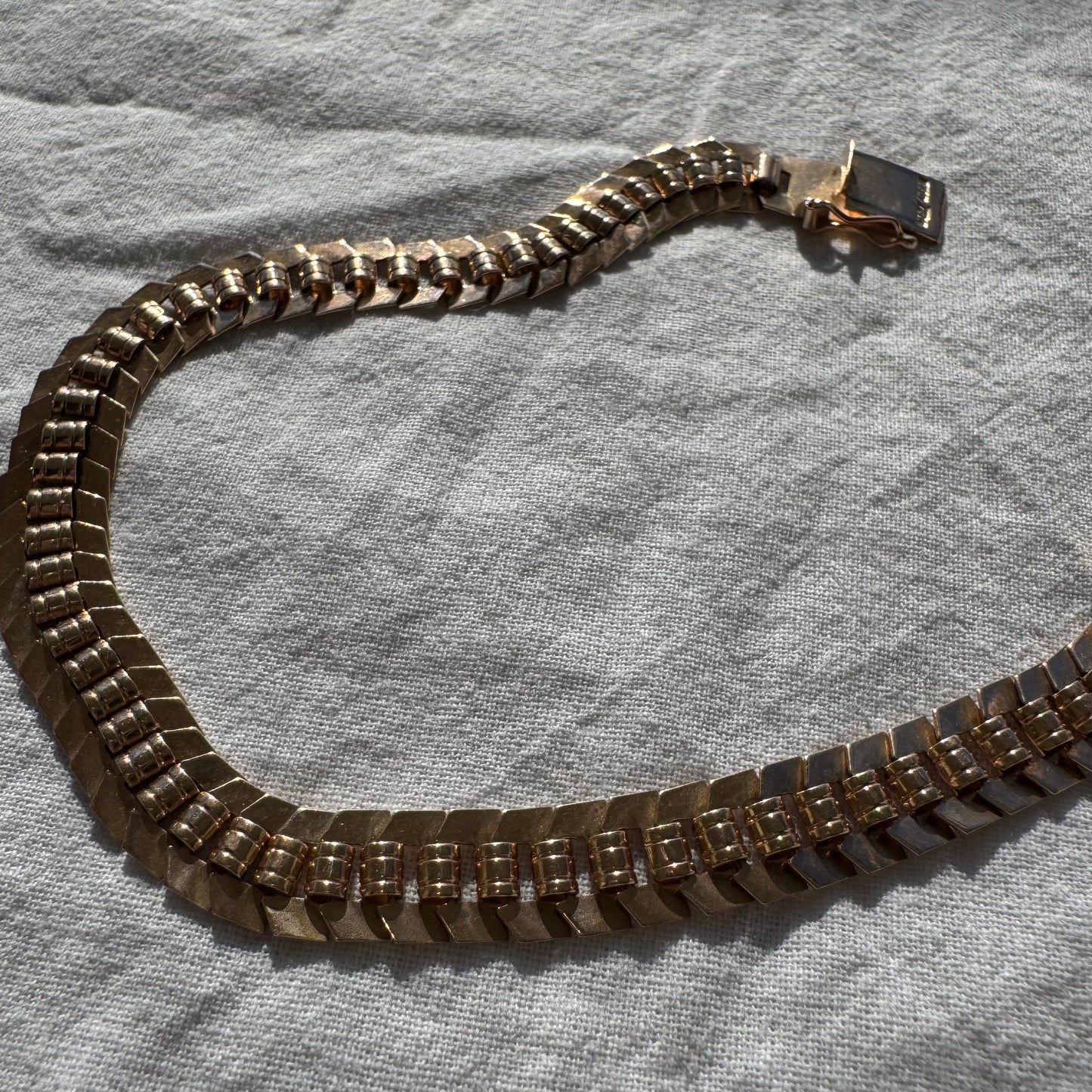 14K gold bracelet with a bold, flexible link design and a secure box clasp.