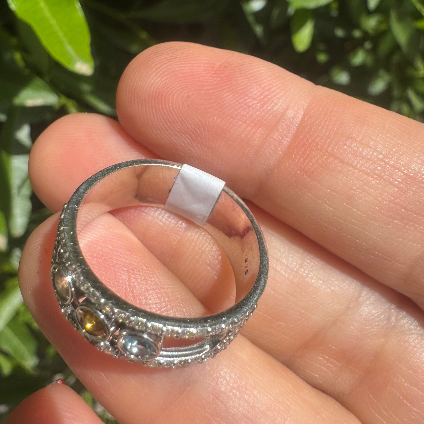 14K gold ring set with Blue Topaz, Citrine, and Rose Quartz, framed by a pave’ of sparkling diamonds