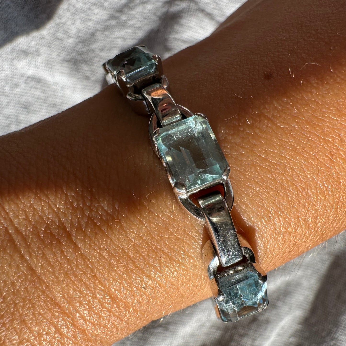 18K white gold bracelet set with large emerald-cut Aquamarine stones — elegant, radiant, and timeless.
