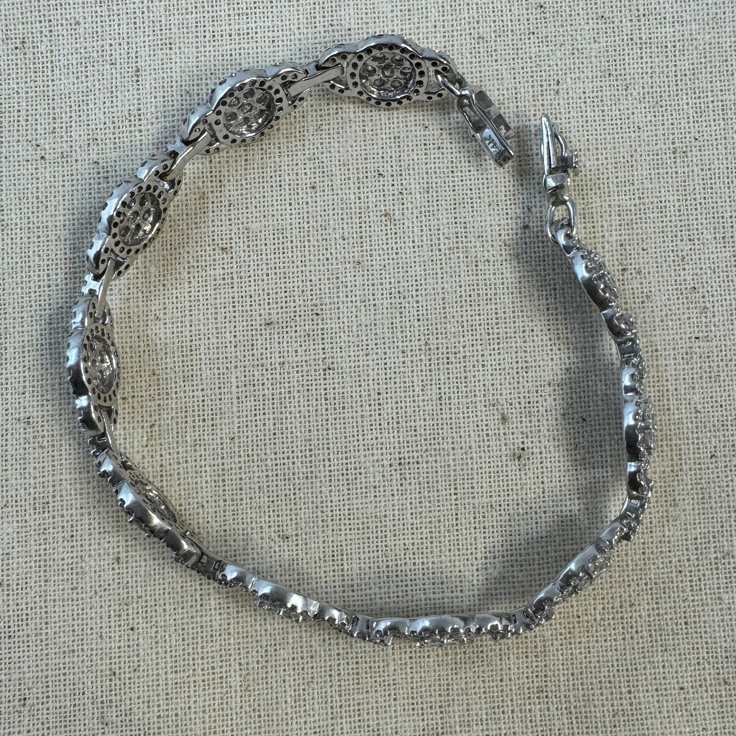 14K gold Tennis bracelet set rows of sparkling Diamonds in a dazzling halo design