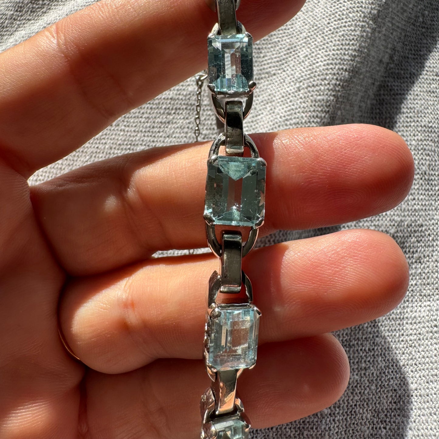 18K white gold bracelet set with large emerald-cut Aquamarine stones — elegant, radiant, and timeless.