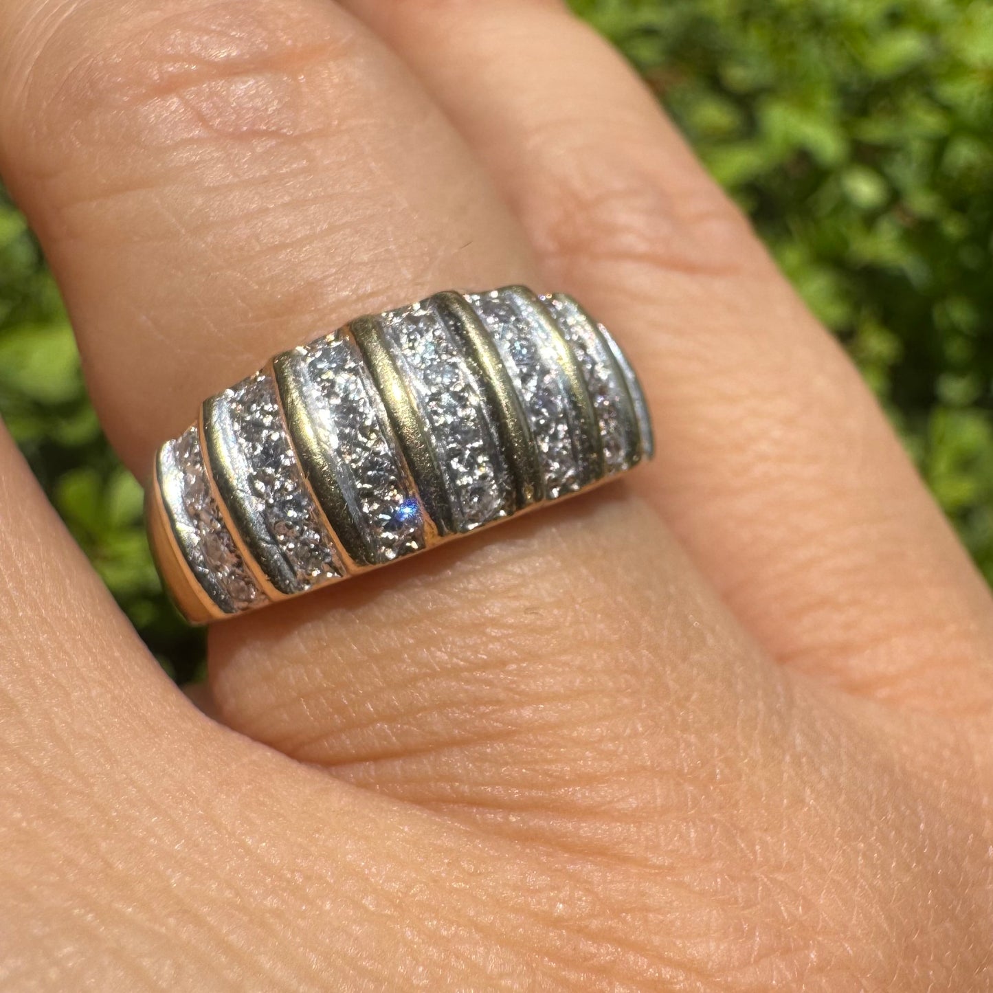 18K gold ring featuring multiple horizontal rows of sparkling Diamonds.