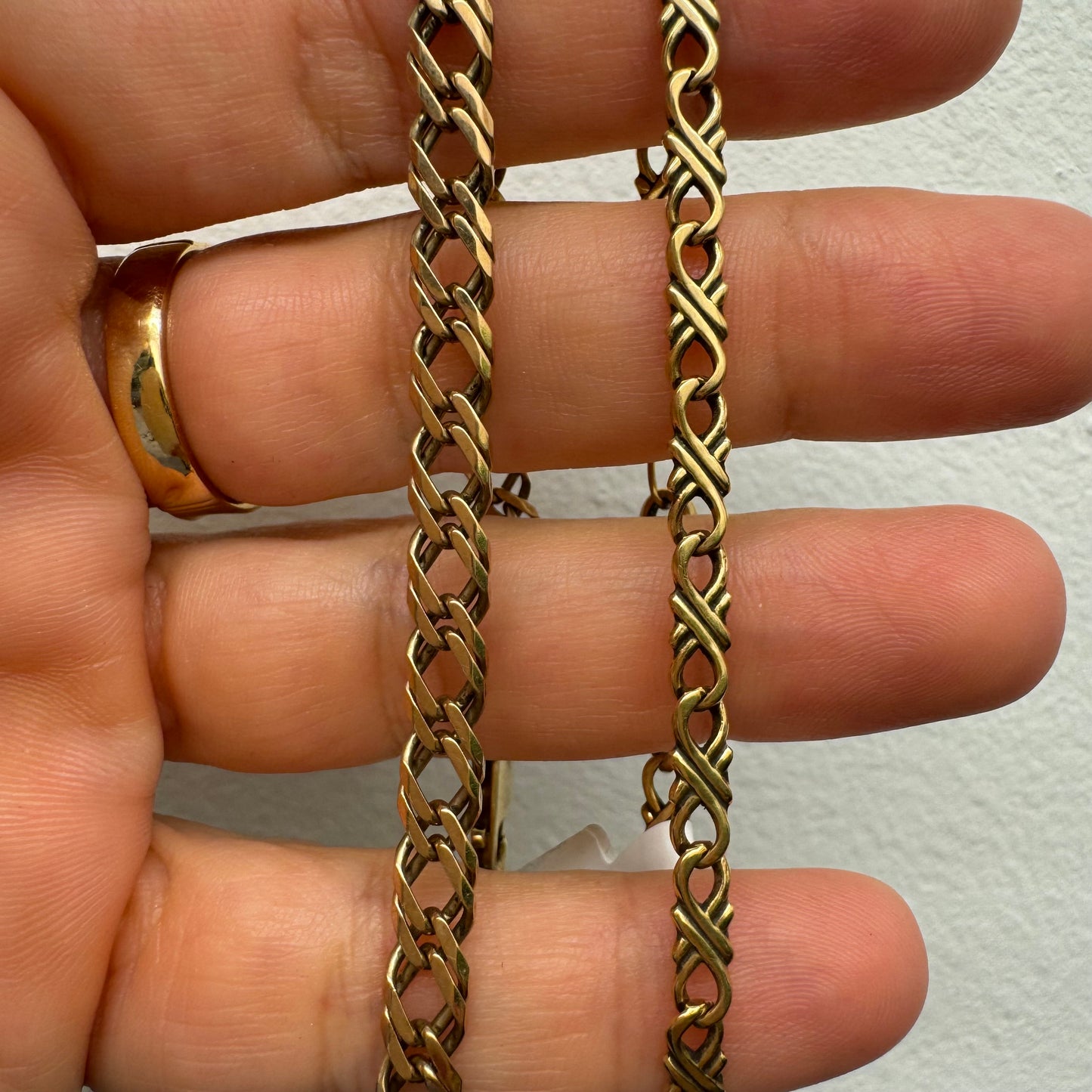 14K gold bracelet with a delicate twisted-link design.