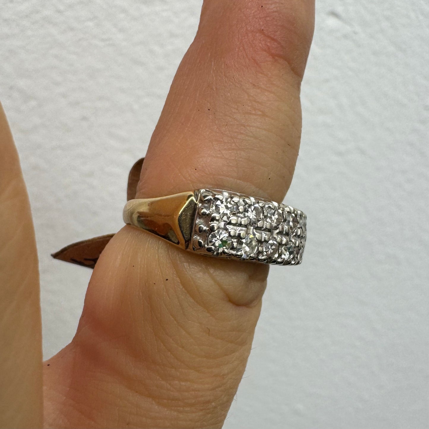 9K (14K) gold ring set with Diamonds in a bold, wide-band design.