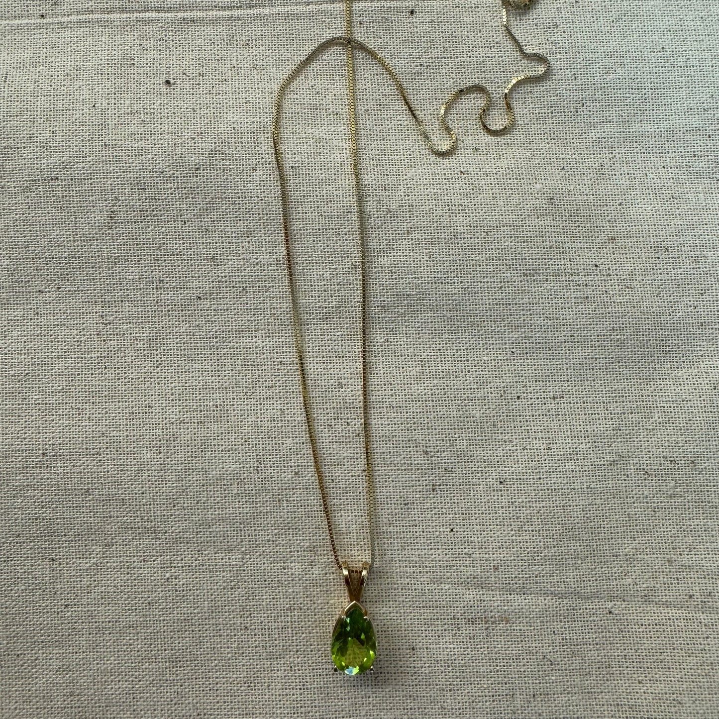14K gold necklace set with a pear-shaped Peridot