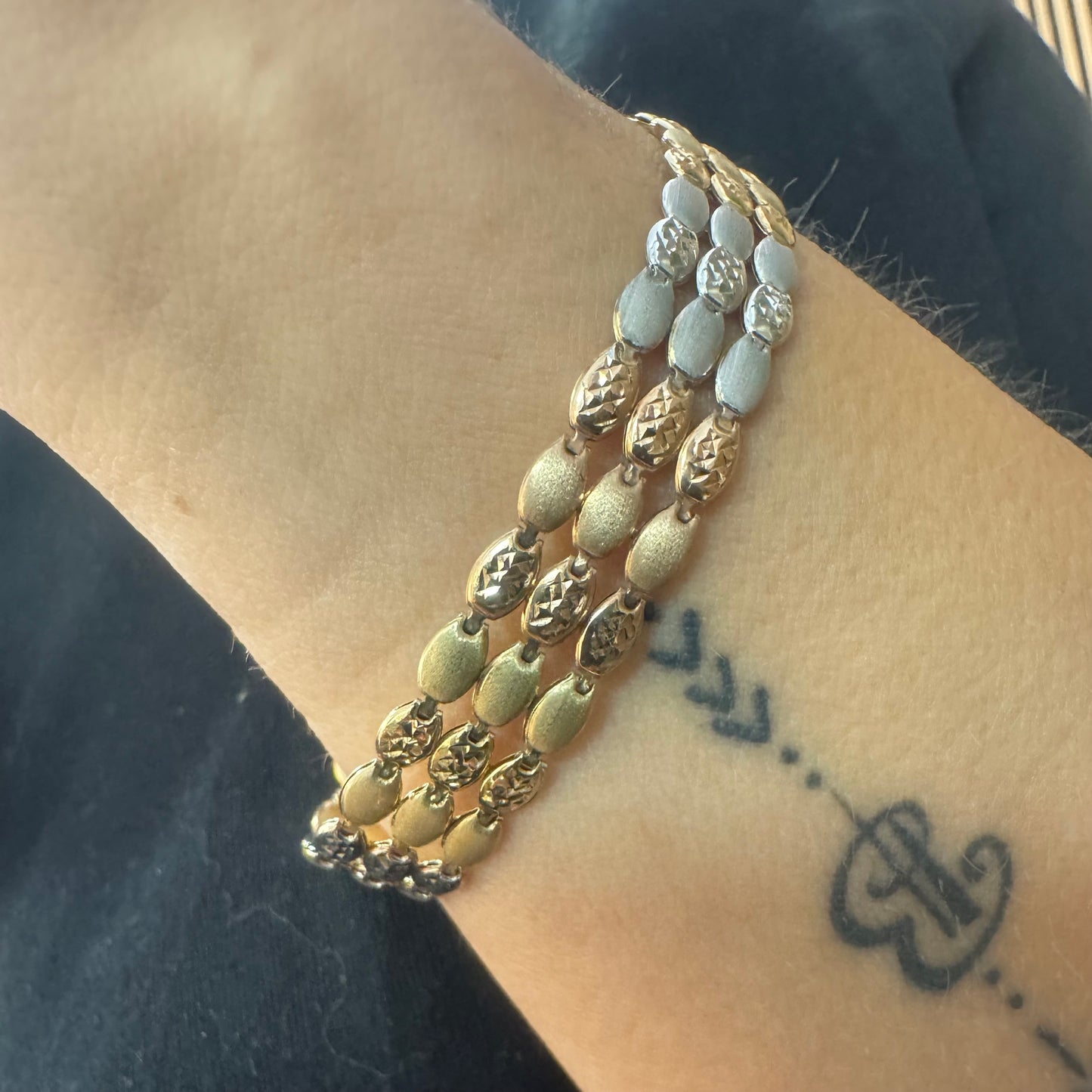 14K tri-color gold bracelet featuring yellow, white and rose gold links