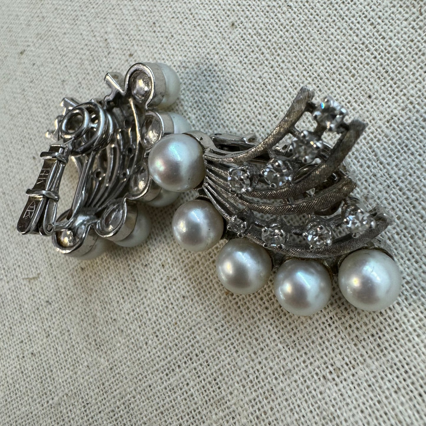 14K gold clip-on earrings set with lustrous pearls & sparkling Diamonds