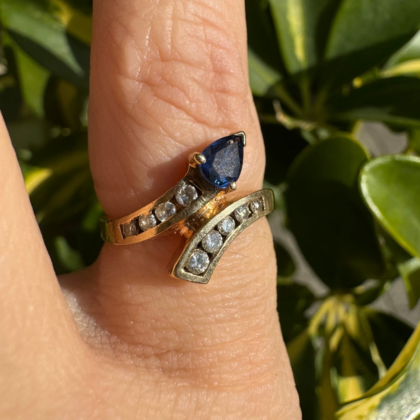 14K gold ring set with a teardrop-shaped Sapphire & Diamonds