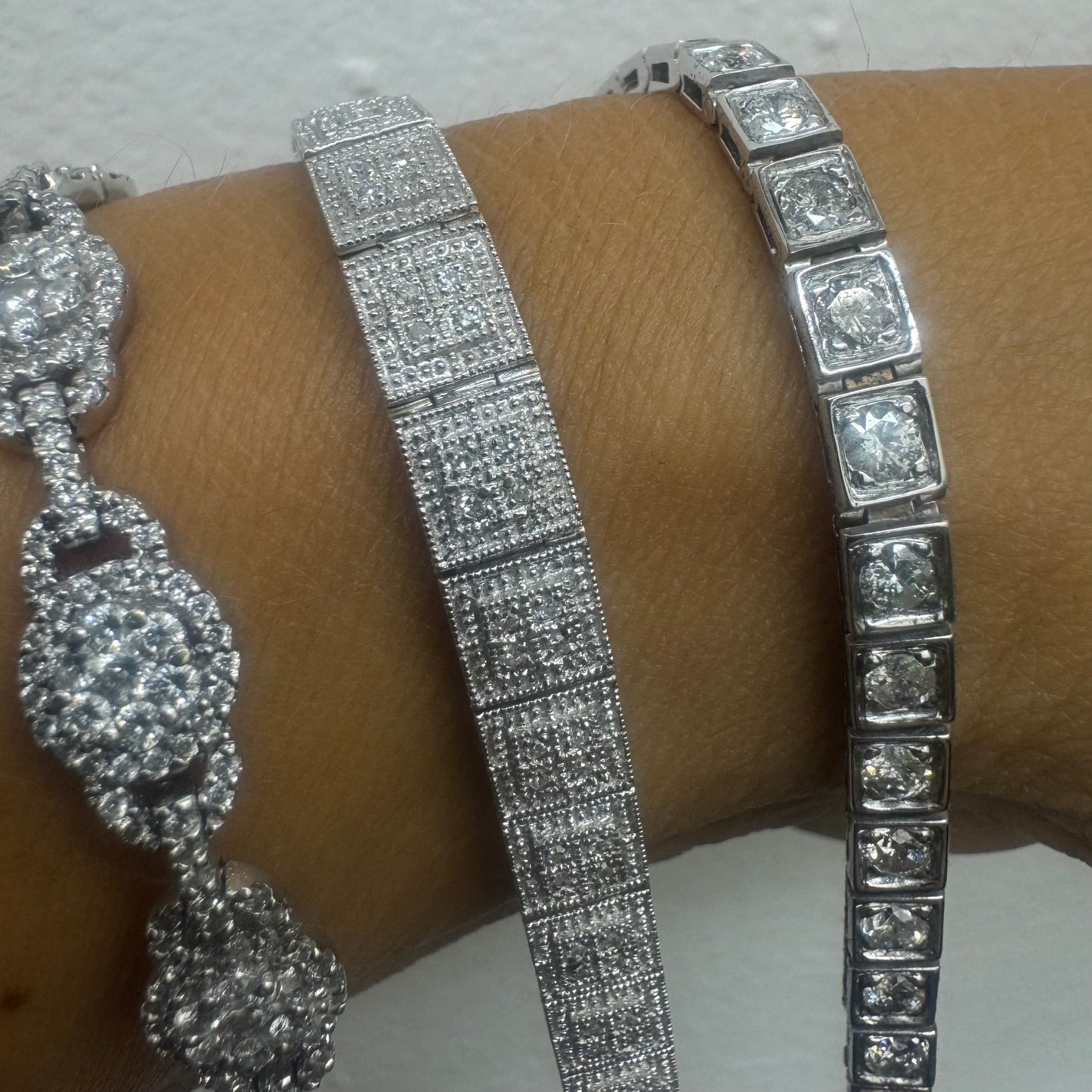 18K gold tennis bracelet set with sparkling round-cut Diamonds in square bezel settings, creating a timeless and sophisticated look.