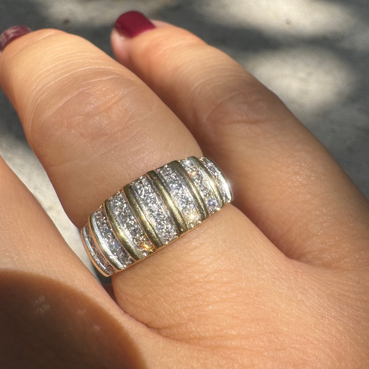 18K gold ring featuring multiple horizontal rows of sparkling Diamonds.