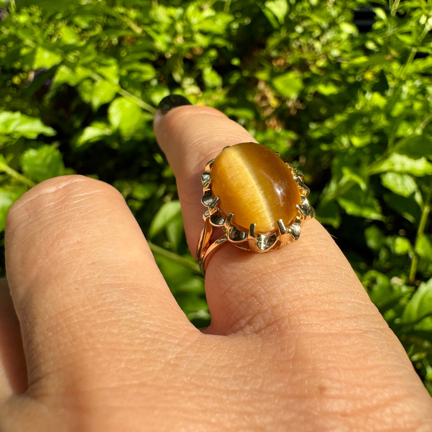 14K gold ring set with a yellow Cat’s Eye cabochon